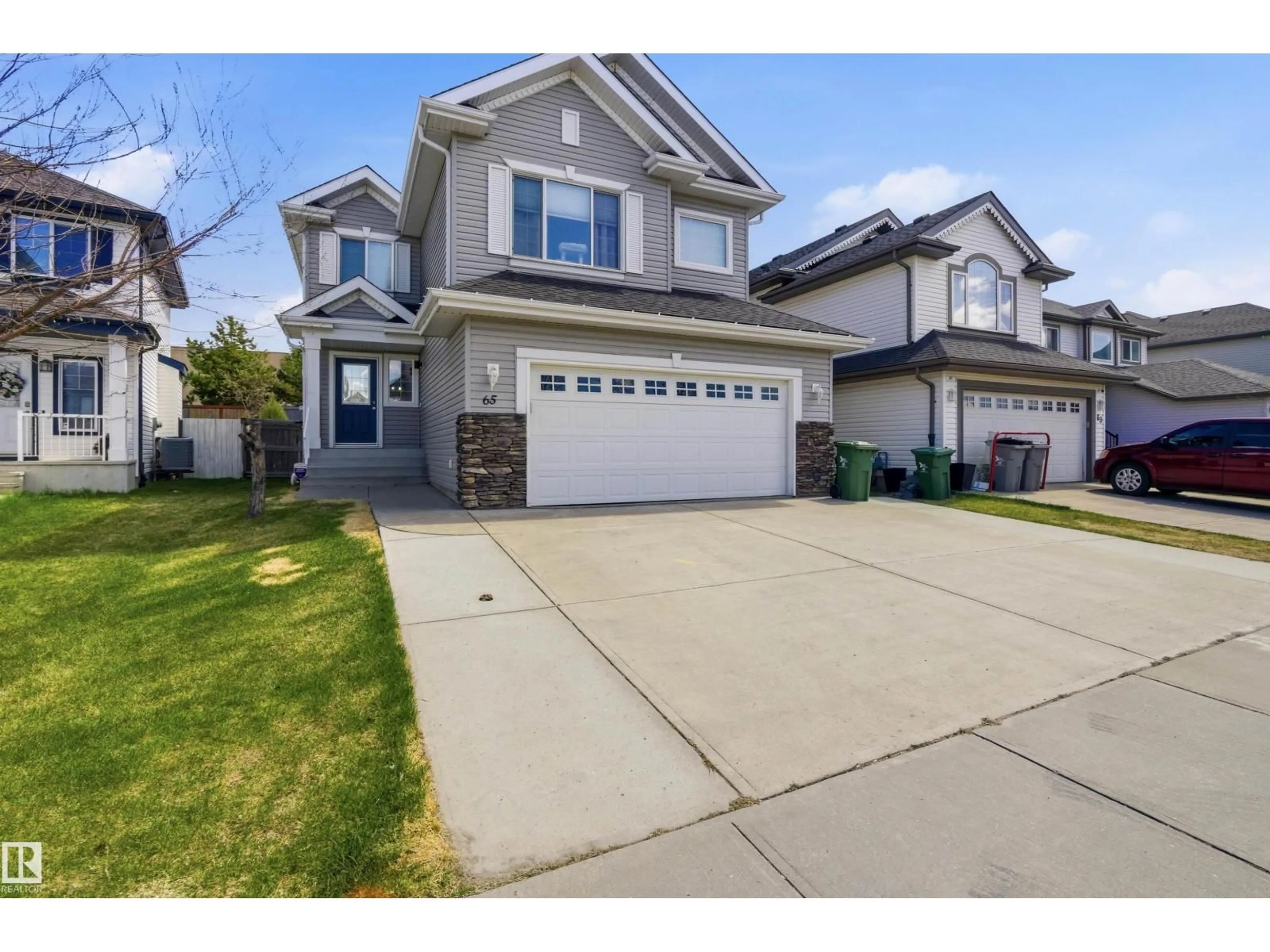 Home with vinyl exterior material, street for 65 RUE MONETTE ST, Beaumont Alberta T4X1T2