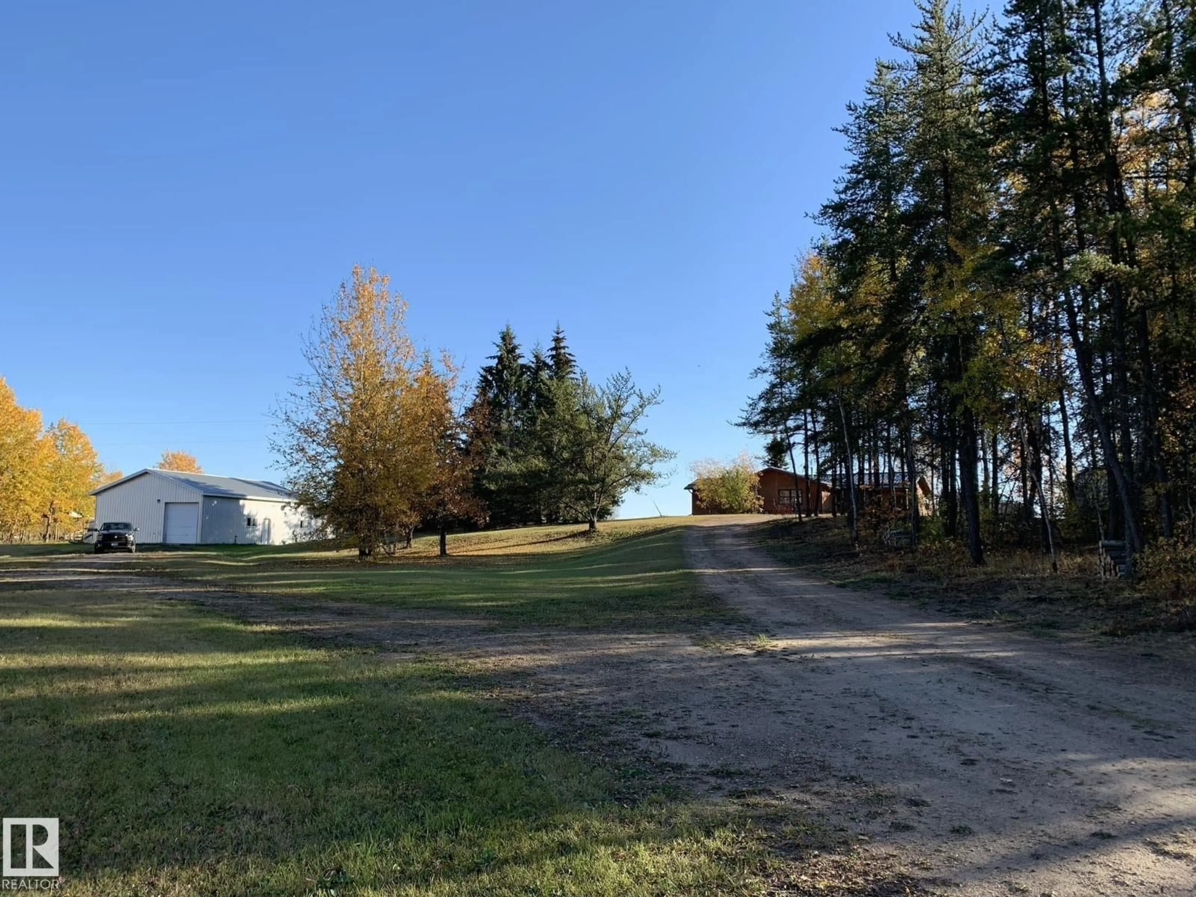 A pic from outside/outdoor area/front of a property/back of a property/a pic from drone, forest/trees view for 49321 TWP RD 630, Rural Bonnyville M.D. Alberta T0A0T0