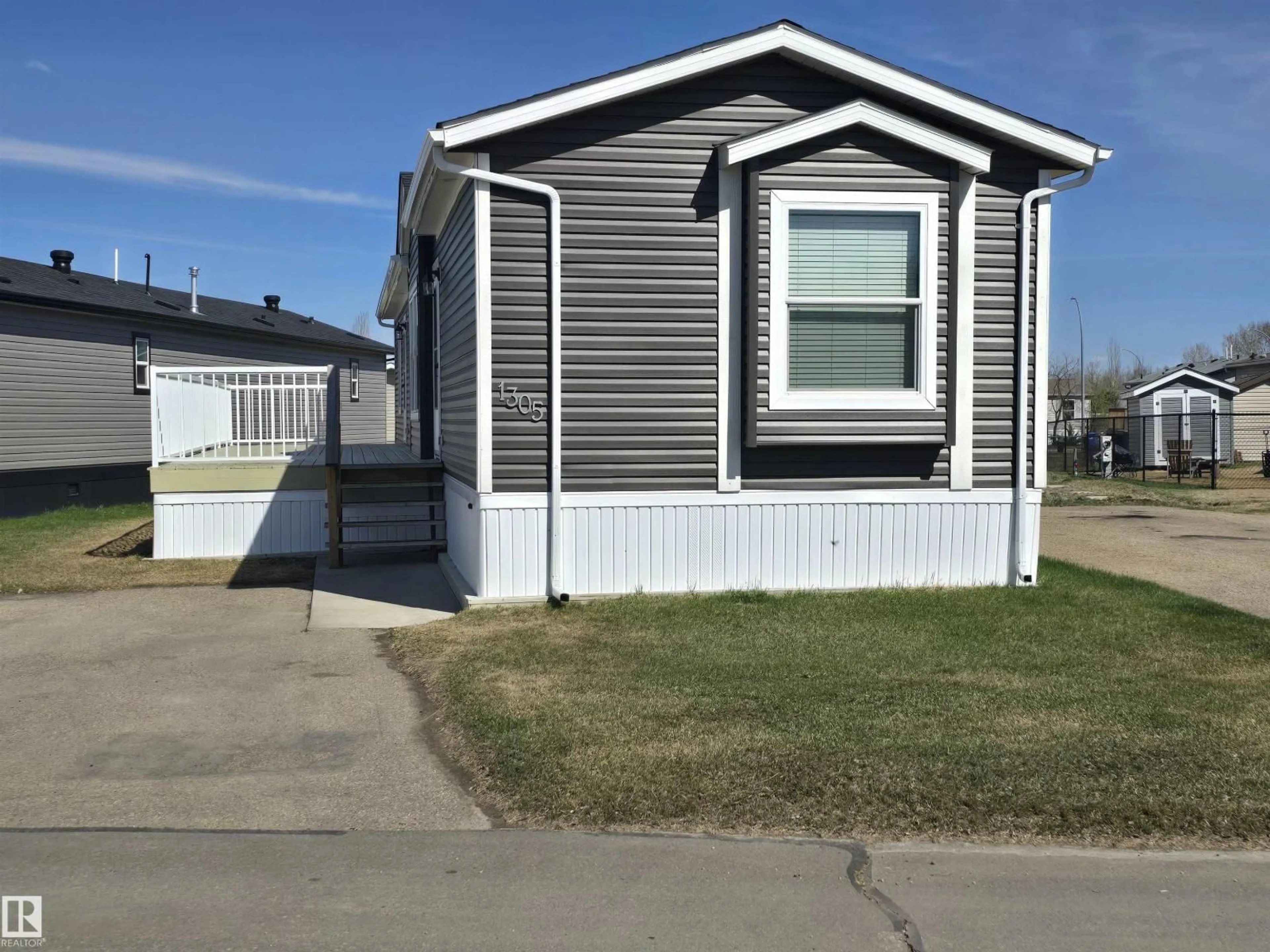 Home with vinyl exterior material, street for 53222 - 1305 RANGE ROAD 272, Rural Parkland County Alberta T7X4M3
