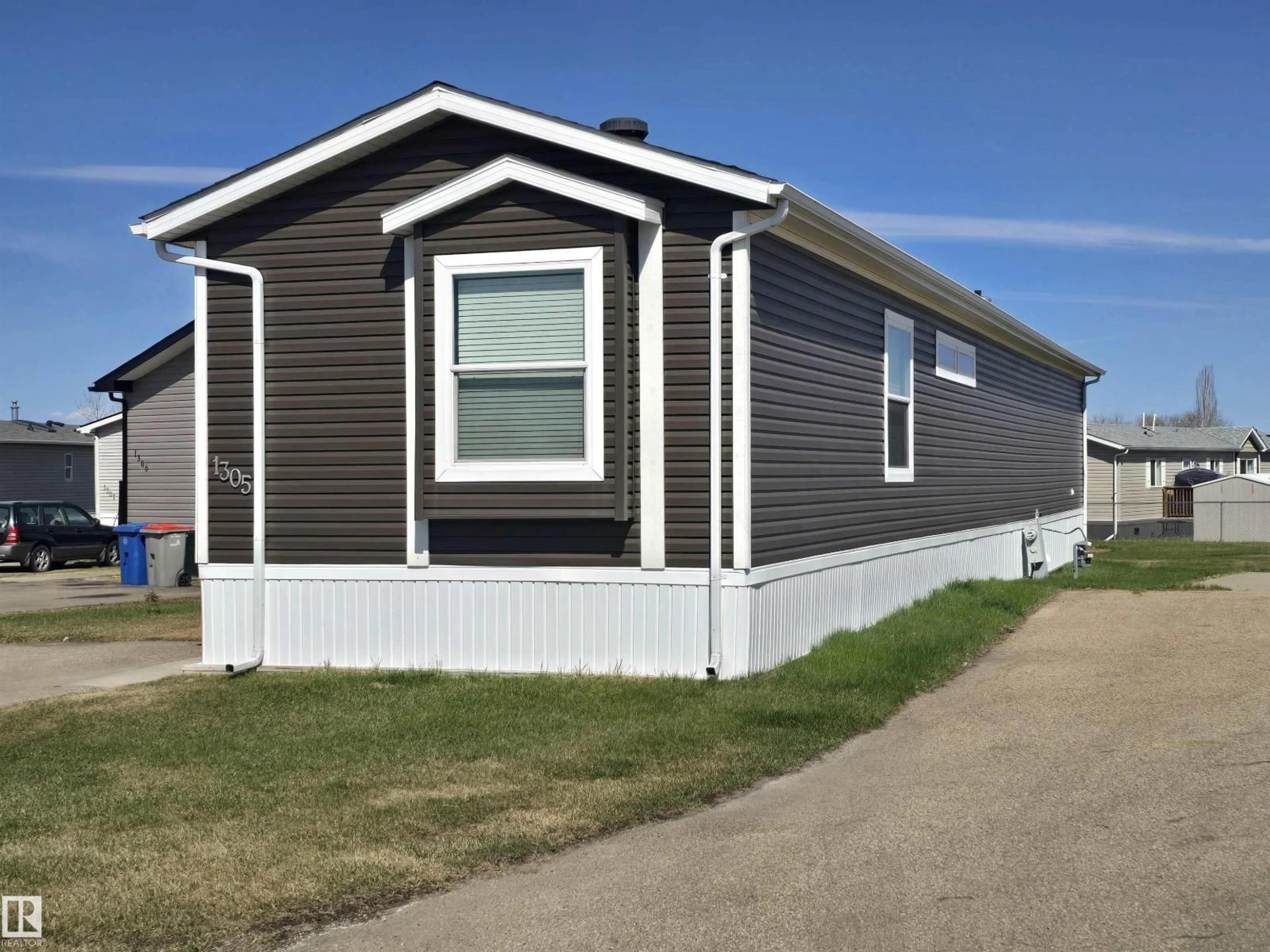 Home with vinyl exterior material, street for 53222 - 1305 RANGE ROAD 272, Rural Parkland County Alberta T7X4M3