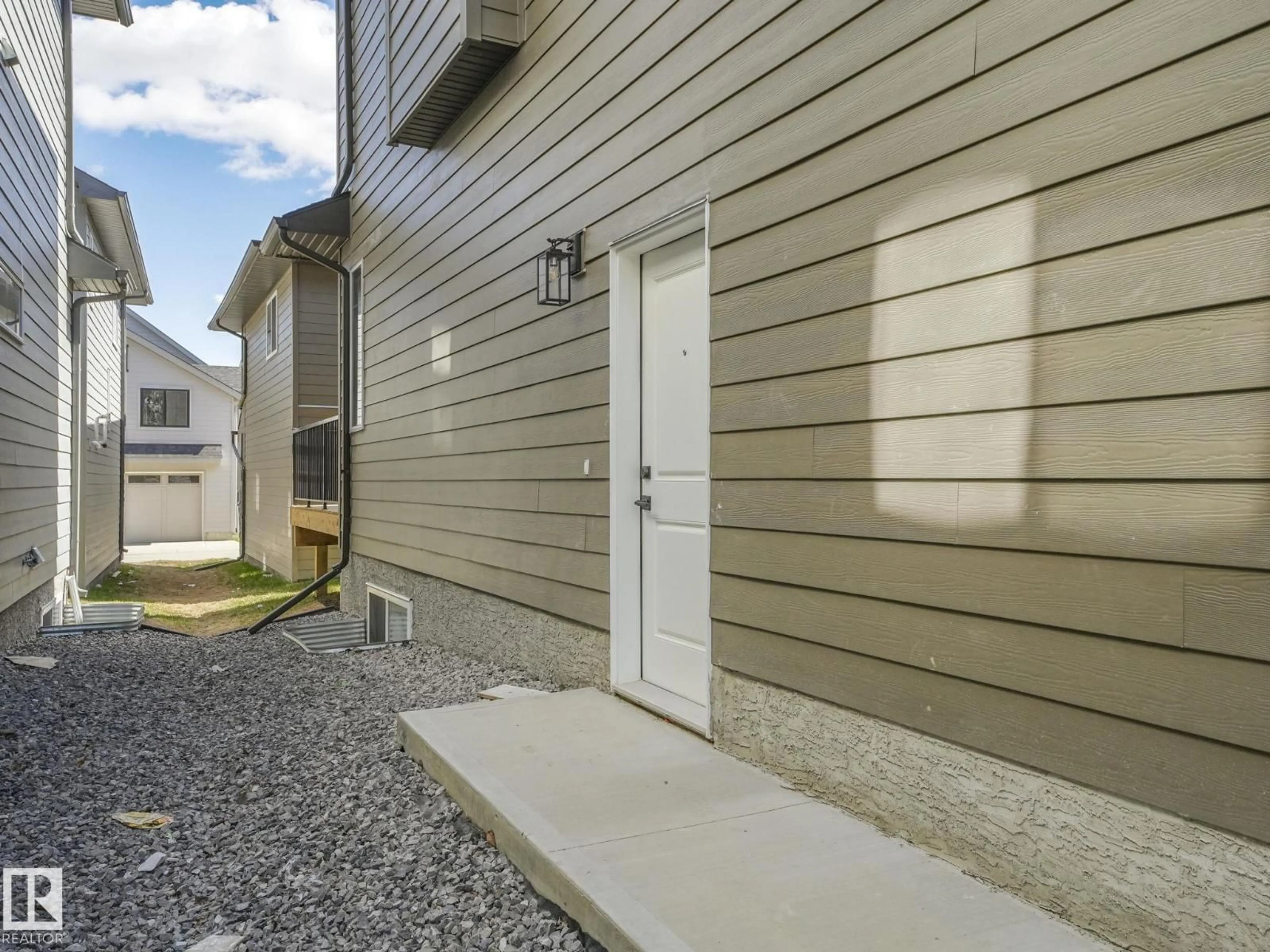 Home with vinyl exterior material, street for 6125 CRAWFORD DR, Edmonton Alberta T6W4L8