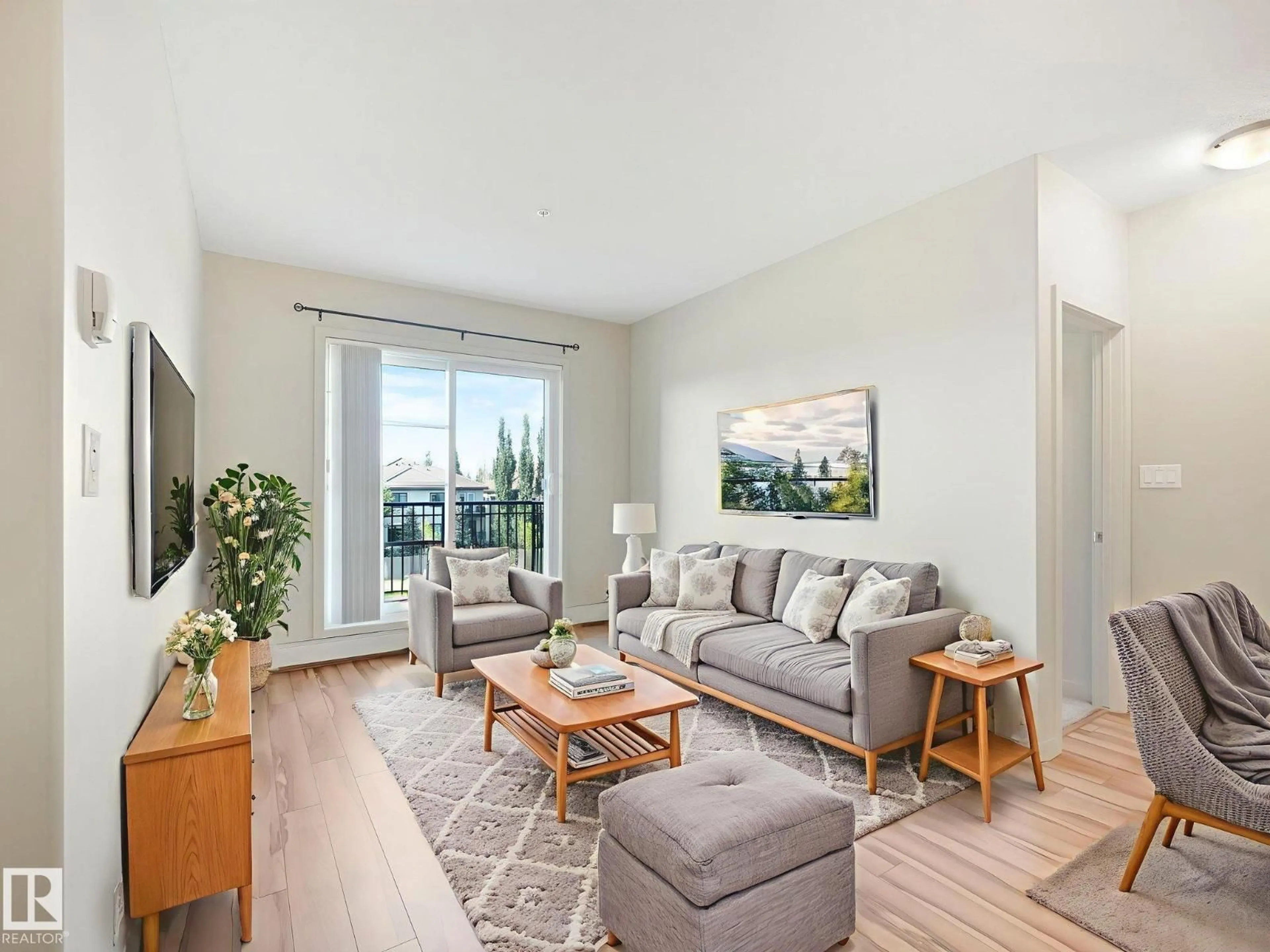 Living room with furniture, wood/laminate floor for 1144 - 317 ADAMSON DR SW, Edmonton Alberta T6W2X7