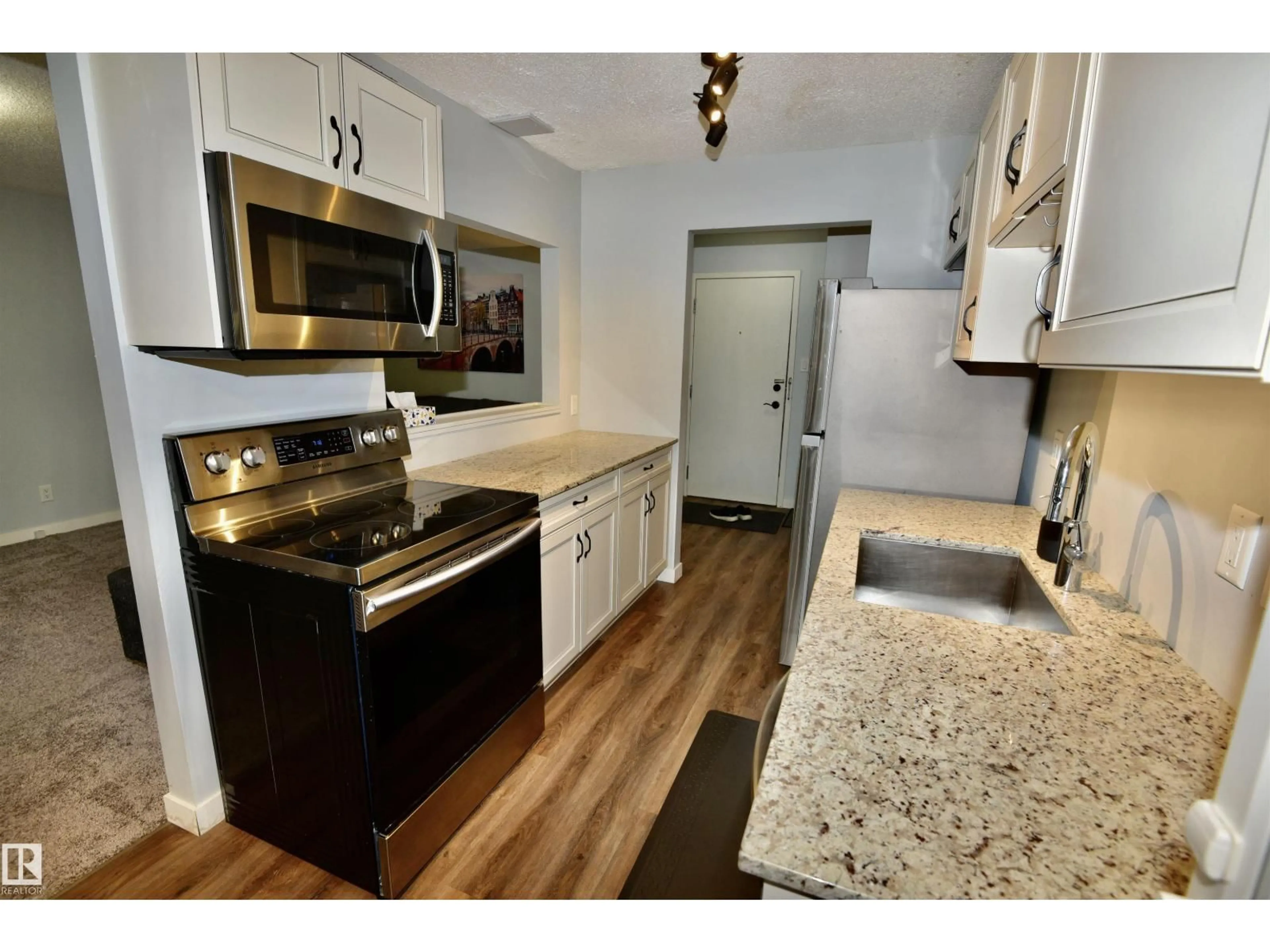 Standard kitchen, wood/laminate floor for #21 - 10160 119 ST, Edmonton Alberta T5K1Y9