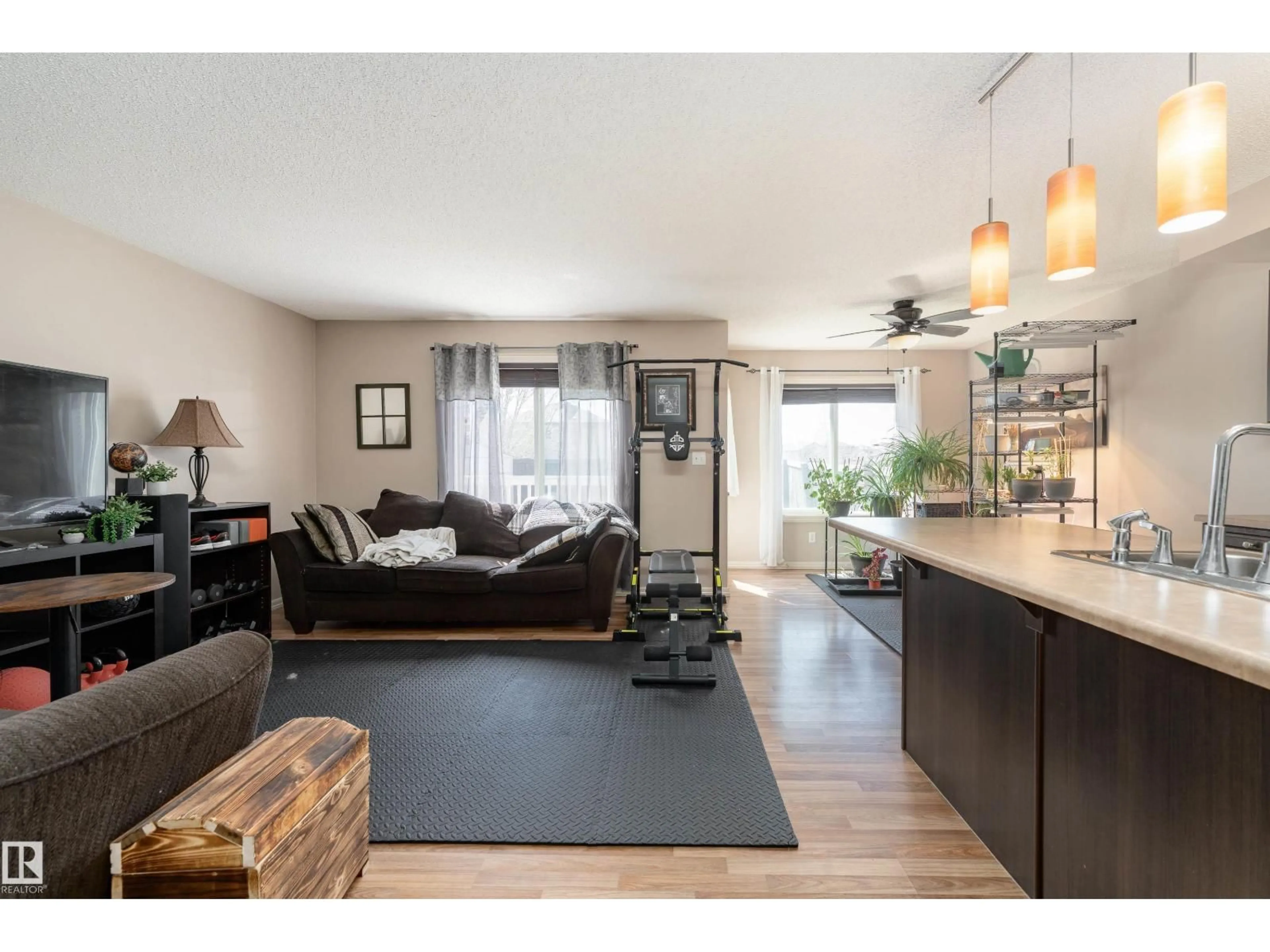 Living room with furniture, wood/laminate floor for 92 CALVERT WD, Fort Saskatchewan Alberta T8L0C4
