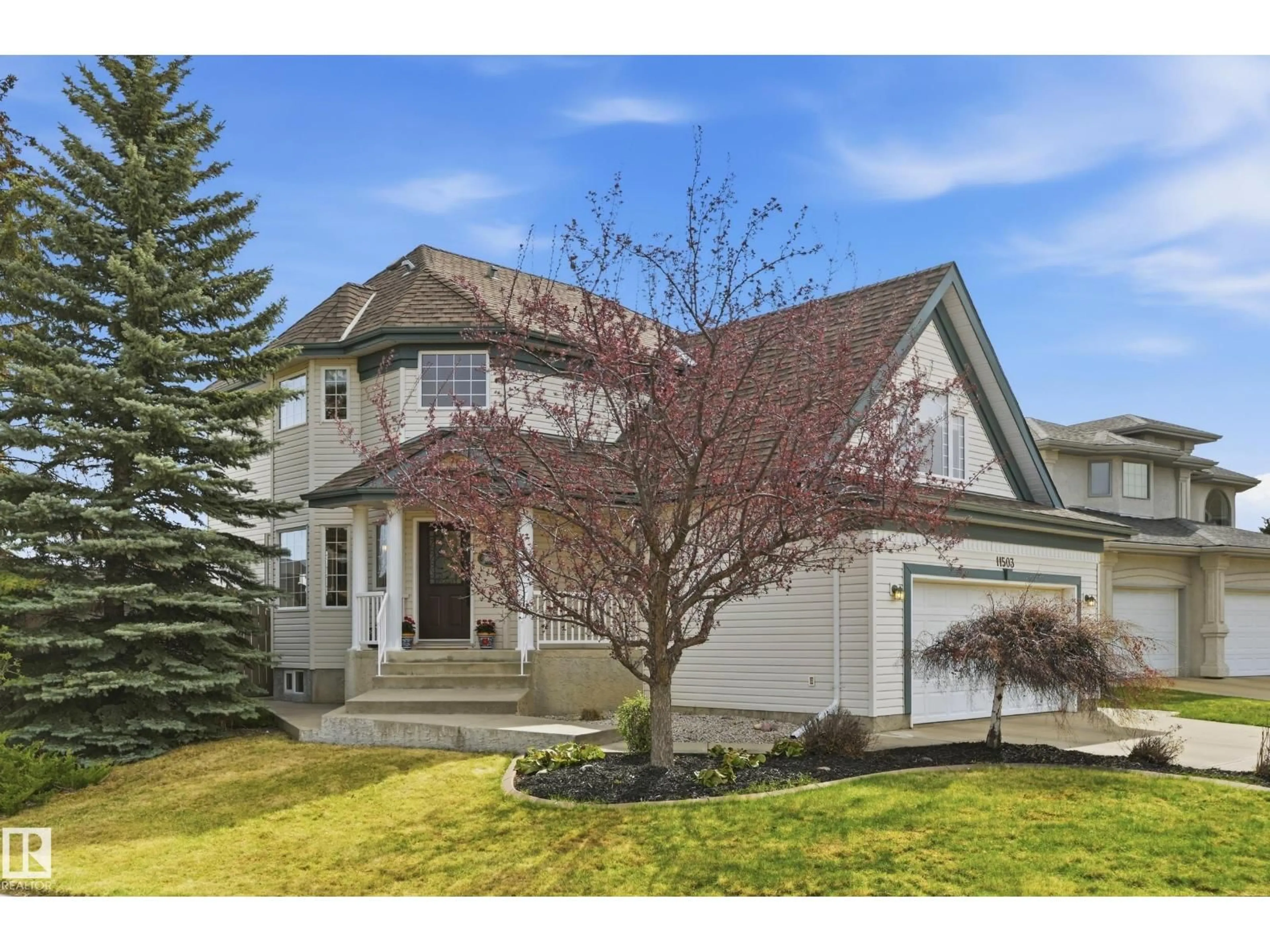 Home with vinyl exterior material, street for 11503 10 AV, Edmonton Alberta T6J6Y2