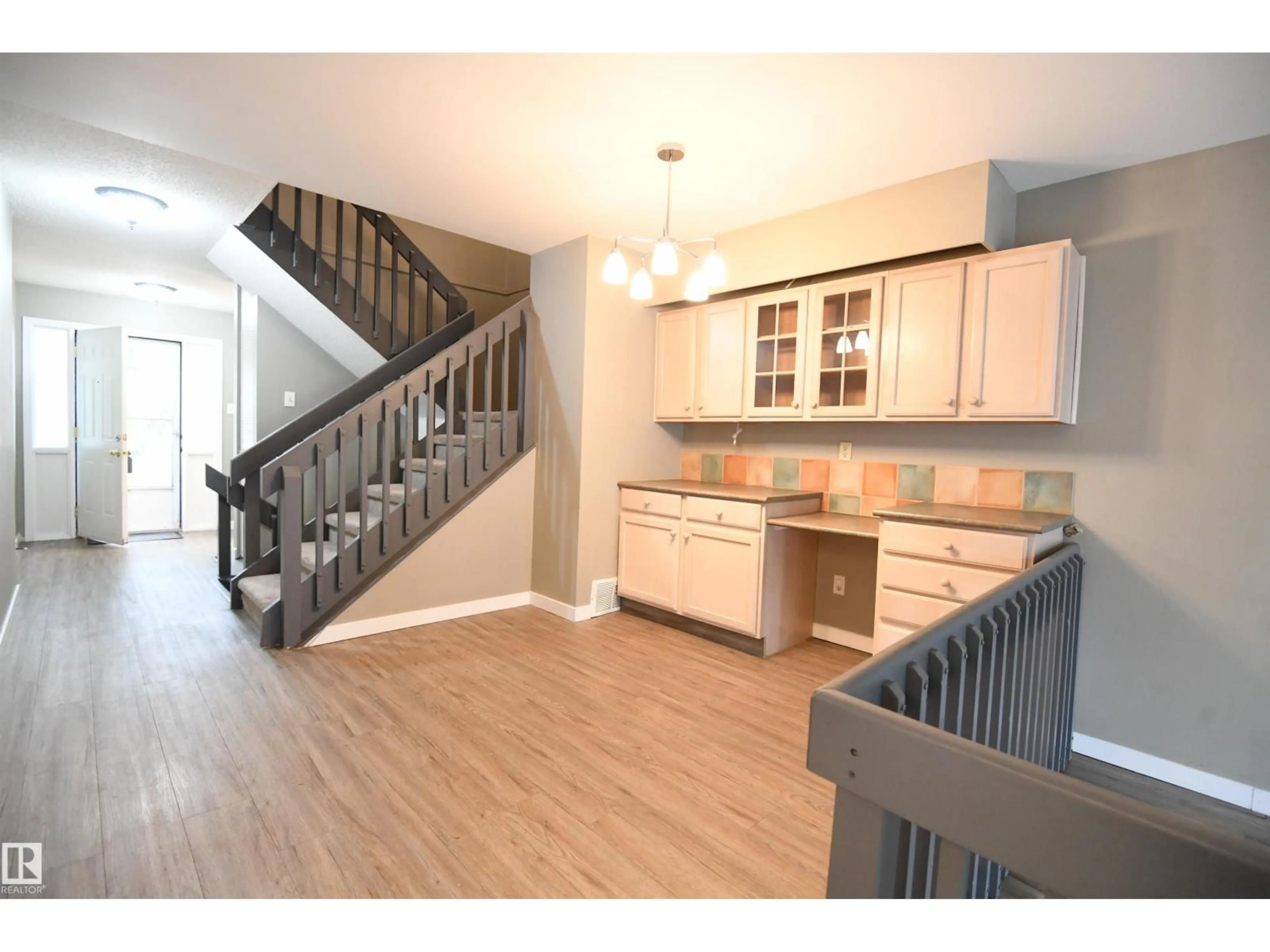 Open concept kitchen, wood/laminate floor for 6706 36A AV, Edmonton Alberta T6K1S3