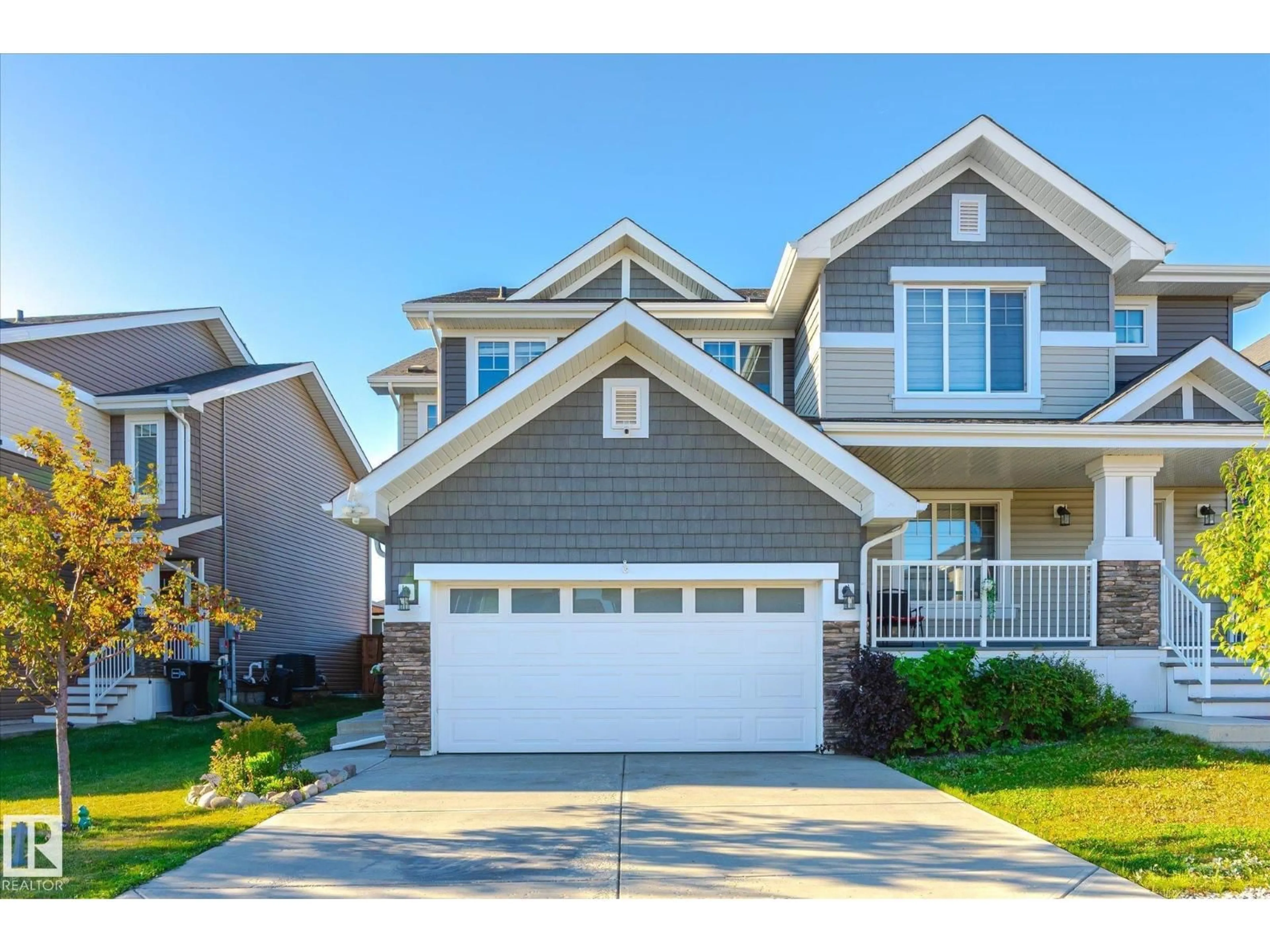 Home with vinyl exterior material, street for 6864 EVANS WD, Edmonton Alberta T6M0T6