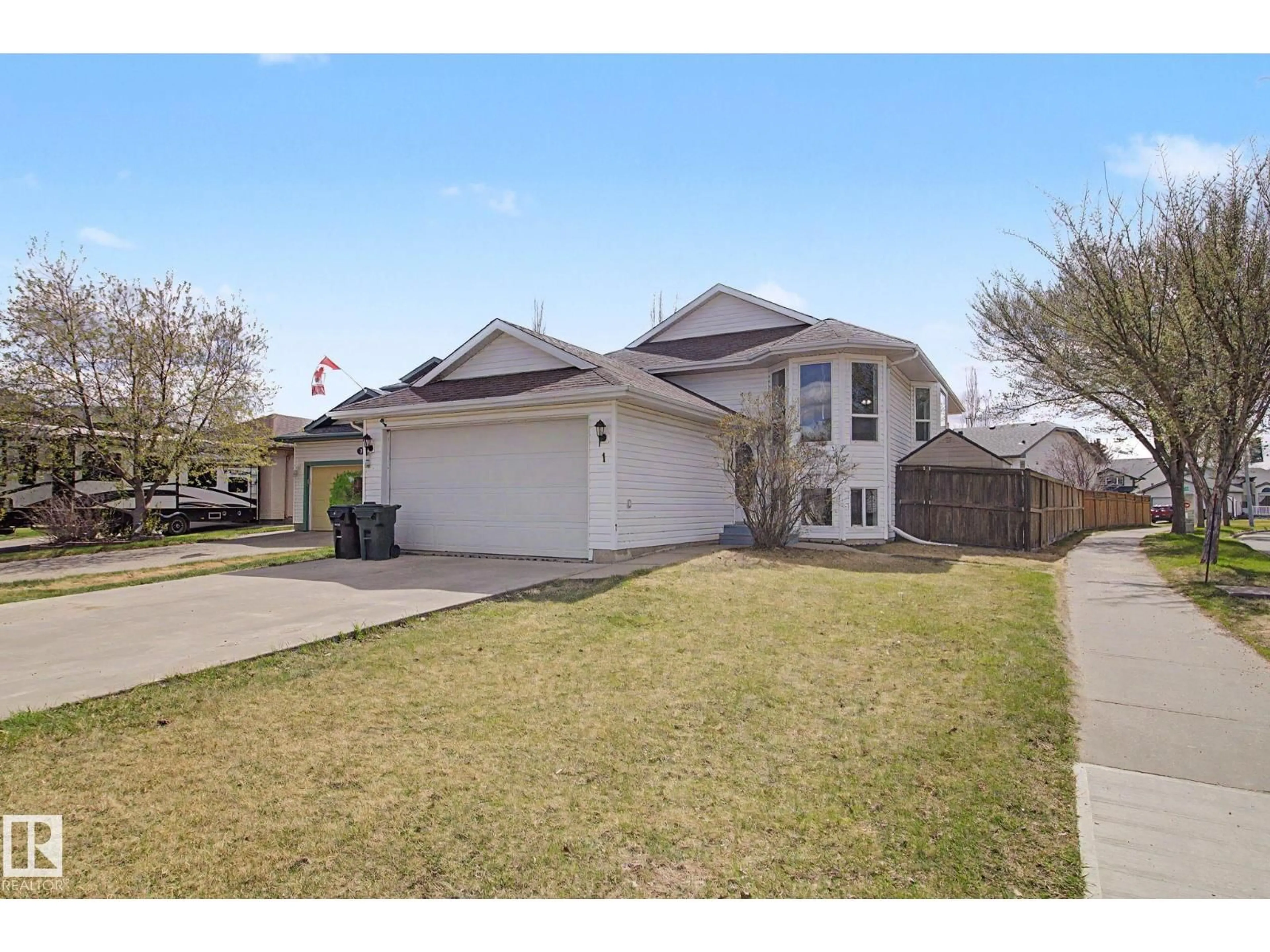 Home with vinyl exterior material, street for 1 DEER PARK RD, Spruce Grove Alberta T7X3K2