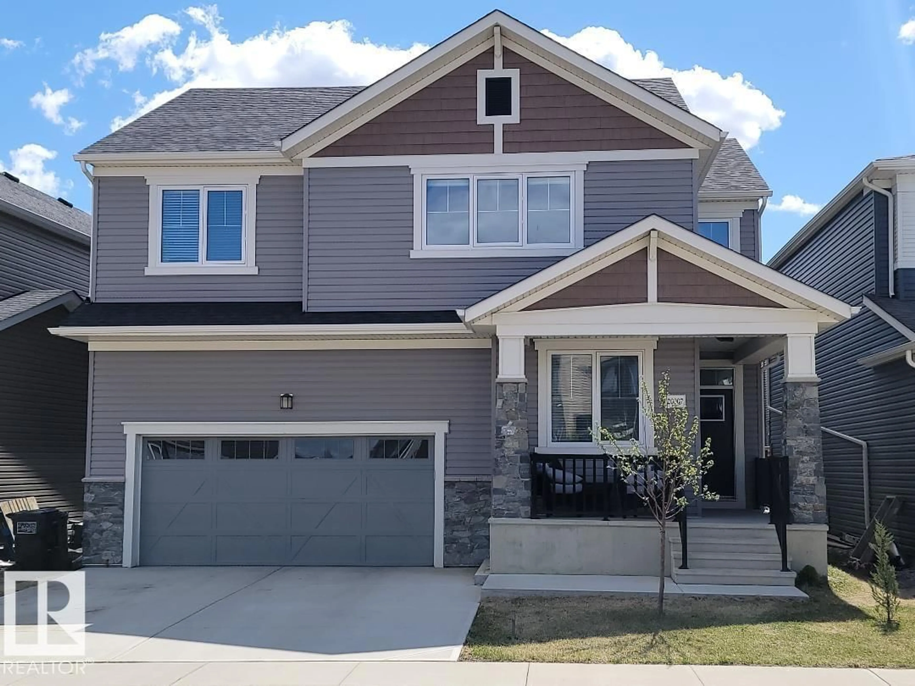 Home with vinyl exterior material, street for NW - 20007 16 AV, Edmonton Alberta T6M0Y3