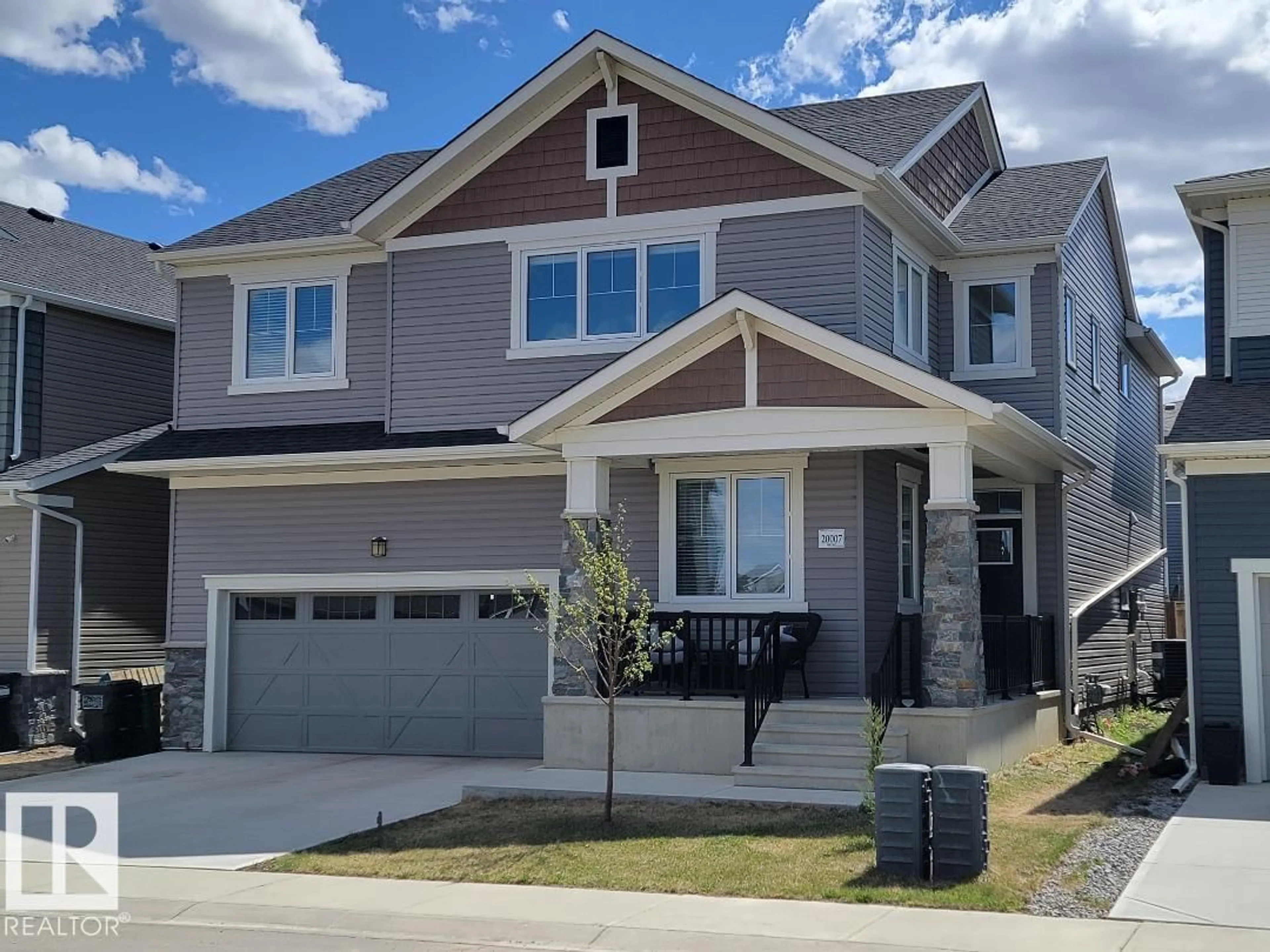 Home with vinyl exterior material, street for NW - 20007 16 AV, Edmonton Alberta T6M0Y3