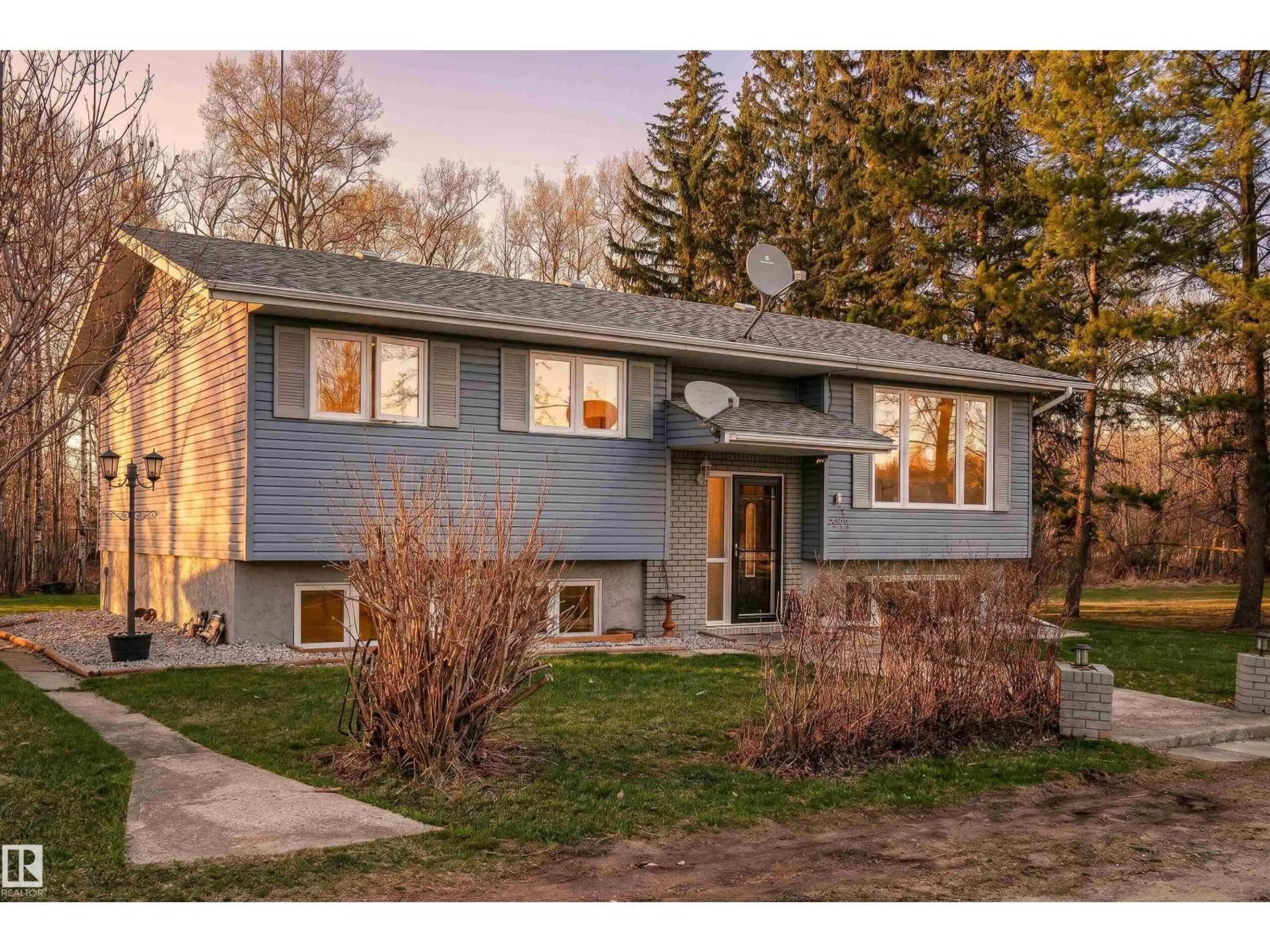 Home with vinyl exterior material, street for 55416 HWY 765, Rural Lac Ste. Anne County Alberta T0E0L0