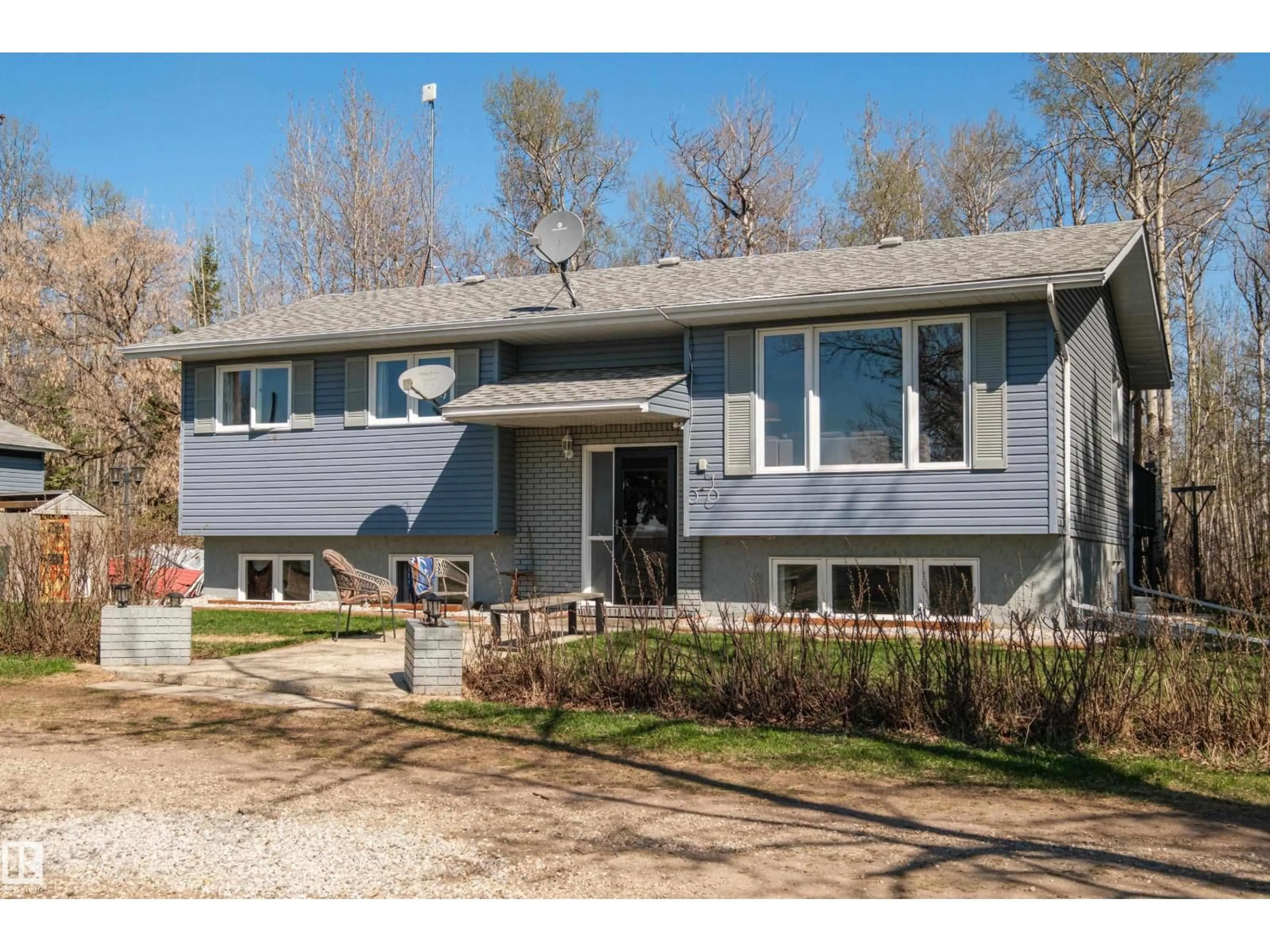 Home with vinyl exterior material, street for 55416 HWY 765, Rural Lac Ste. Anne County Alberta T0E0L0