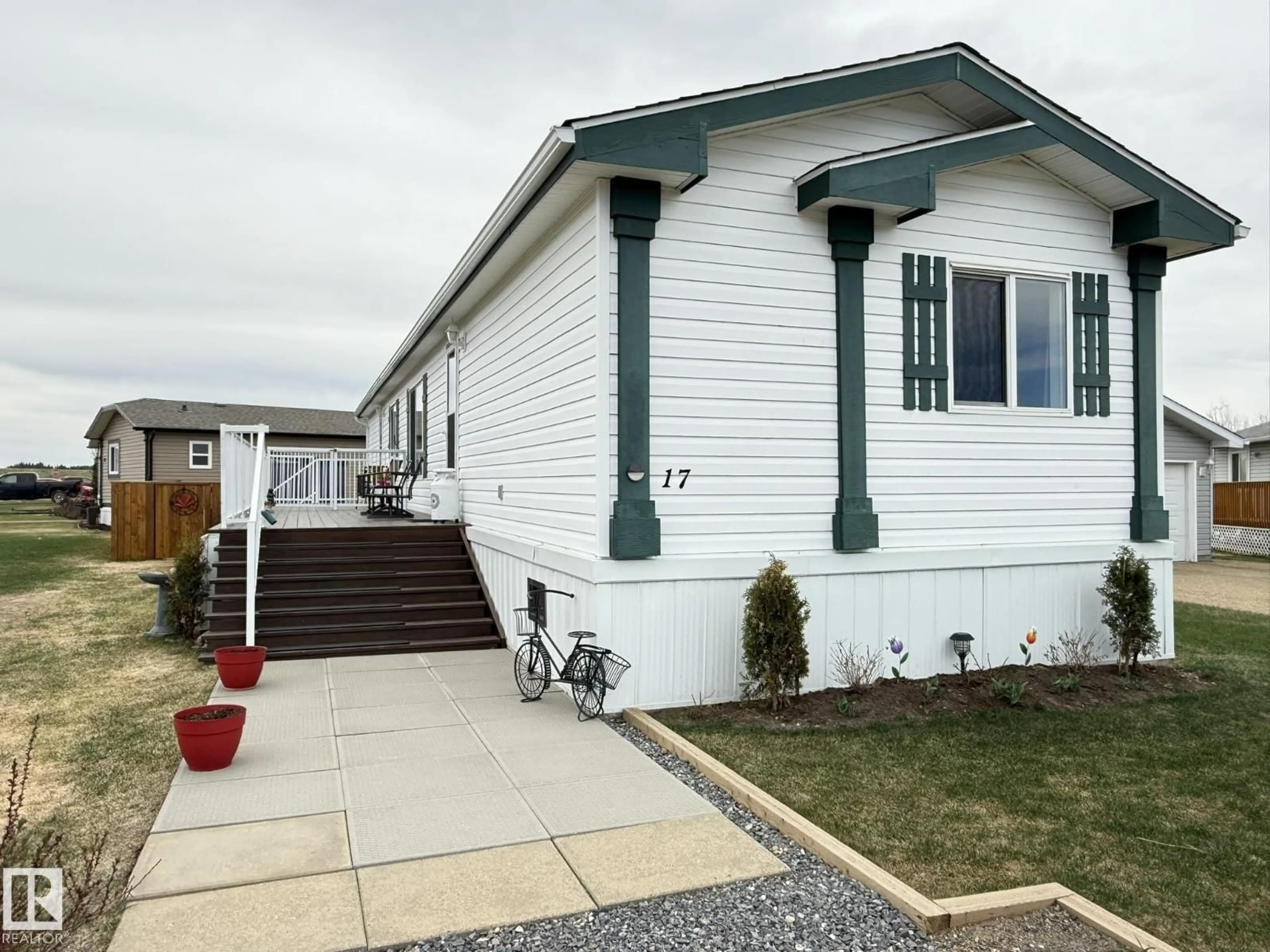 Home with vinyl exterior material, street for 17 MIDLAND RD, Millet Alberta T0C1Z0