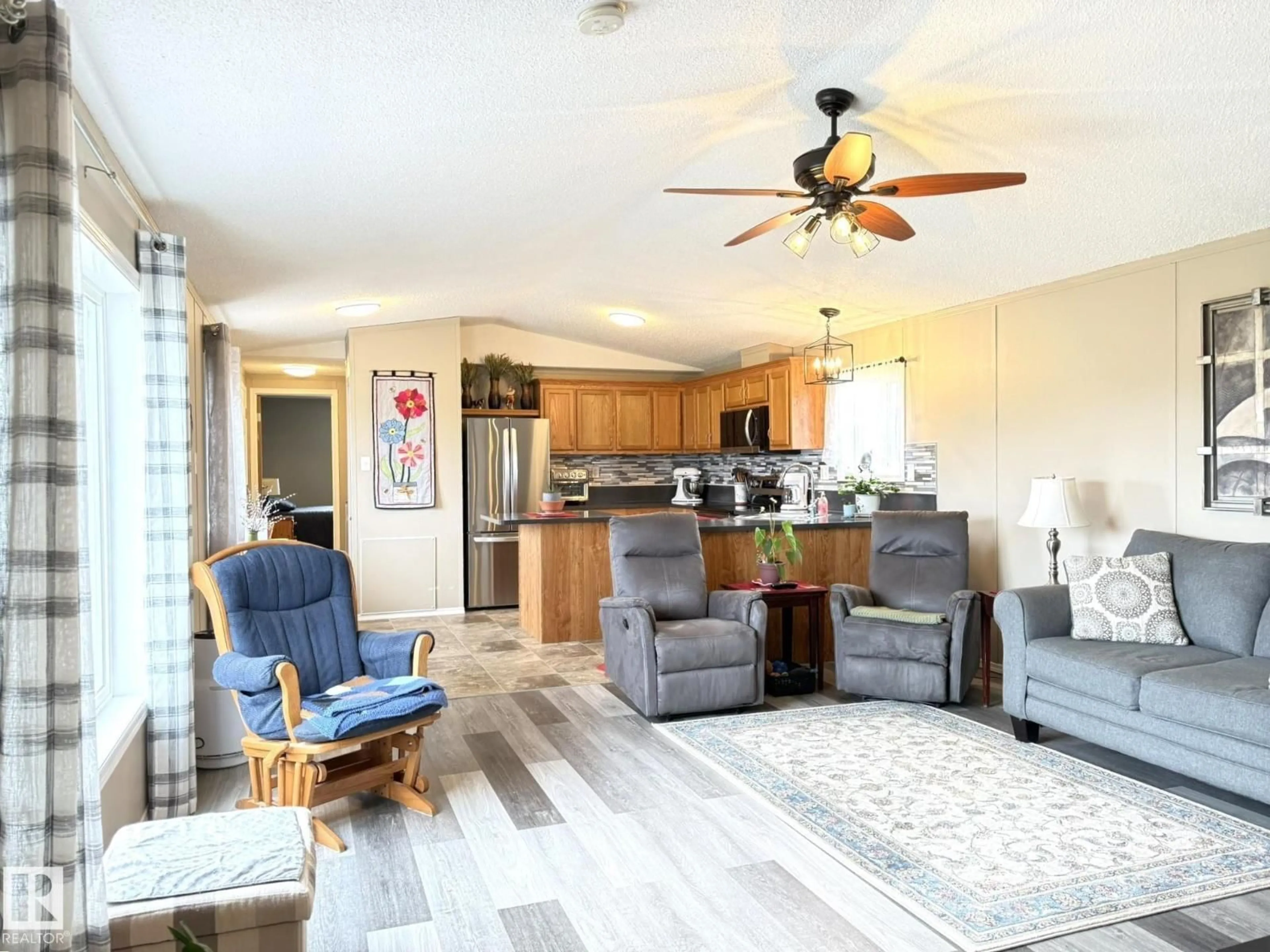 Living room with furniture, wood/laminate floor for 17 MIDLAND RD, Millet Alberta T0C1Z0