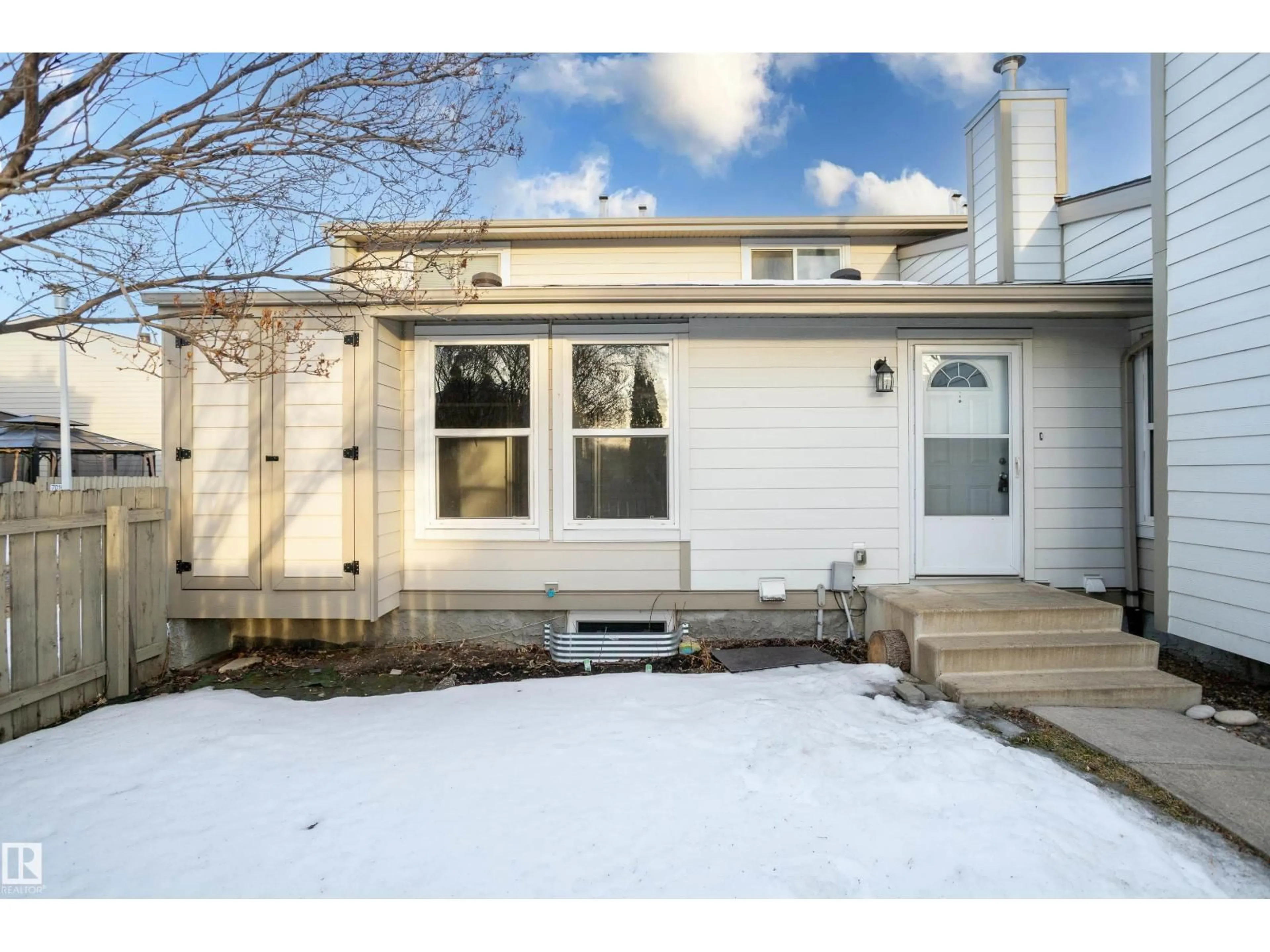 Home with vinyl exterior material, street for 7032 MILL WOODS RD, Edmonton Alberta T6K3M3