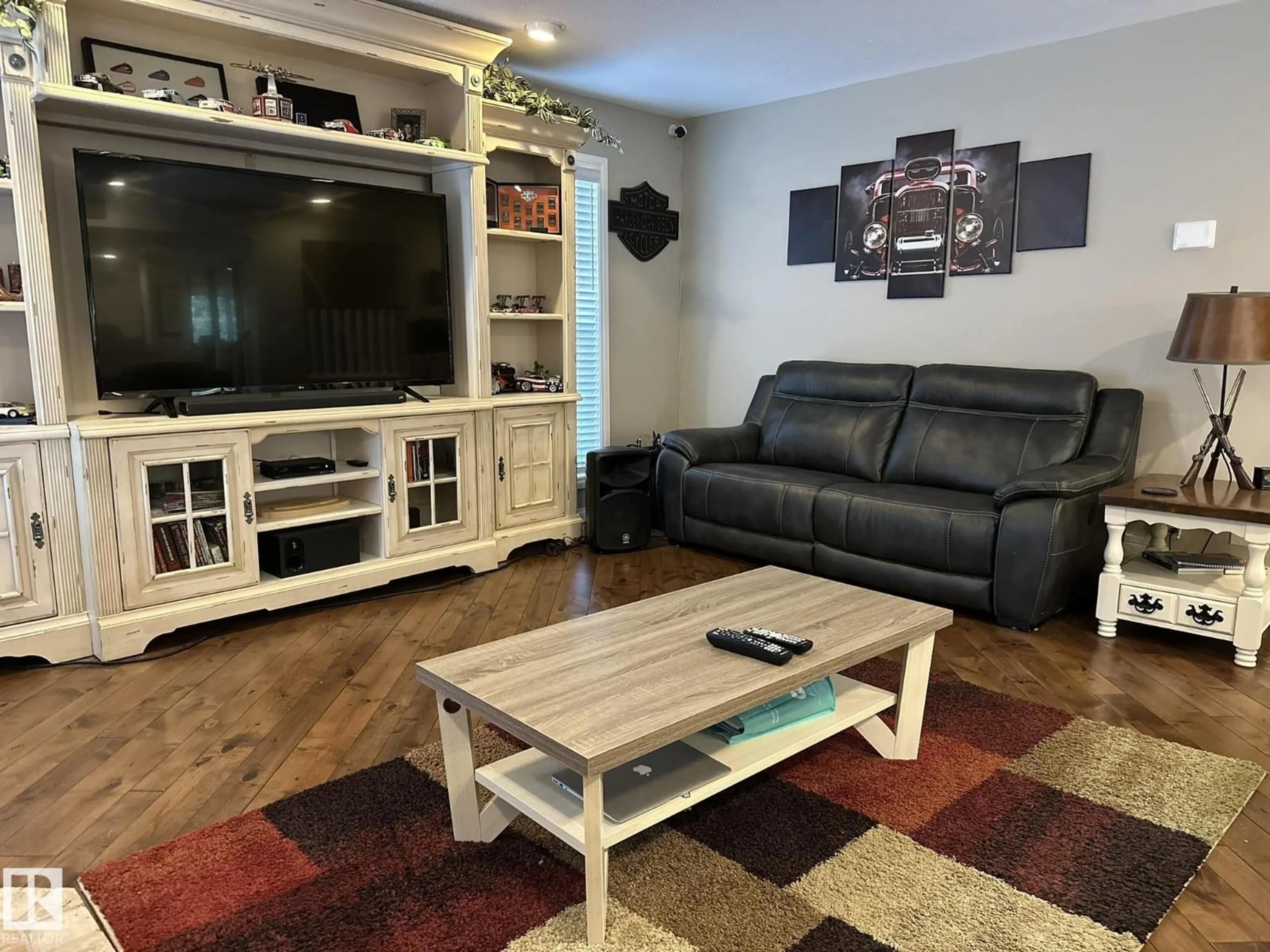 Living room with furniture, wood/laminate floor for 59536 - 342 RANGE 132A RD, Rural Smoky Lake County Alberta T0A3C0