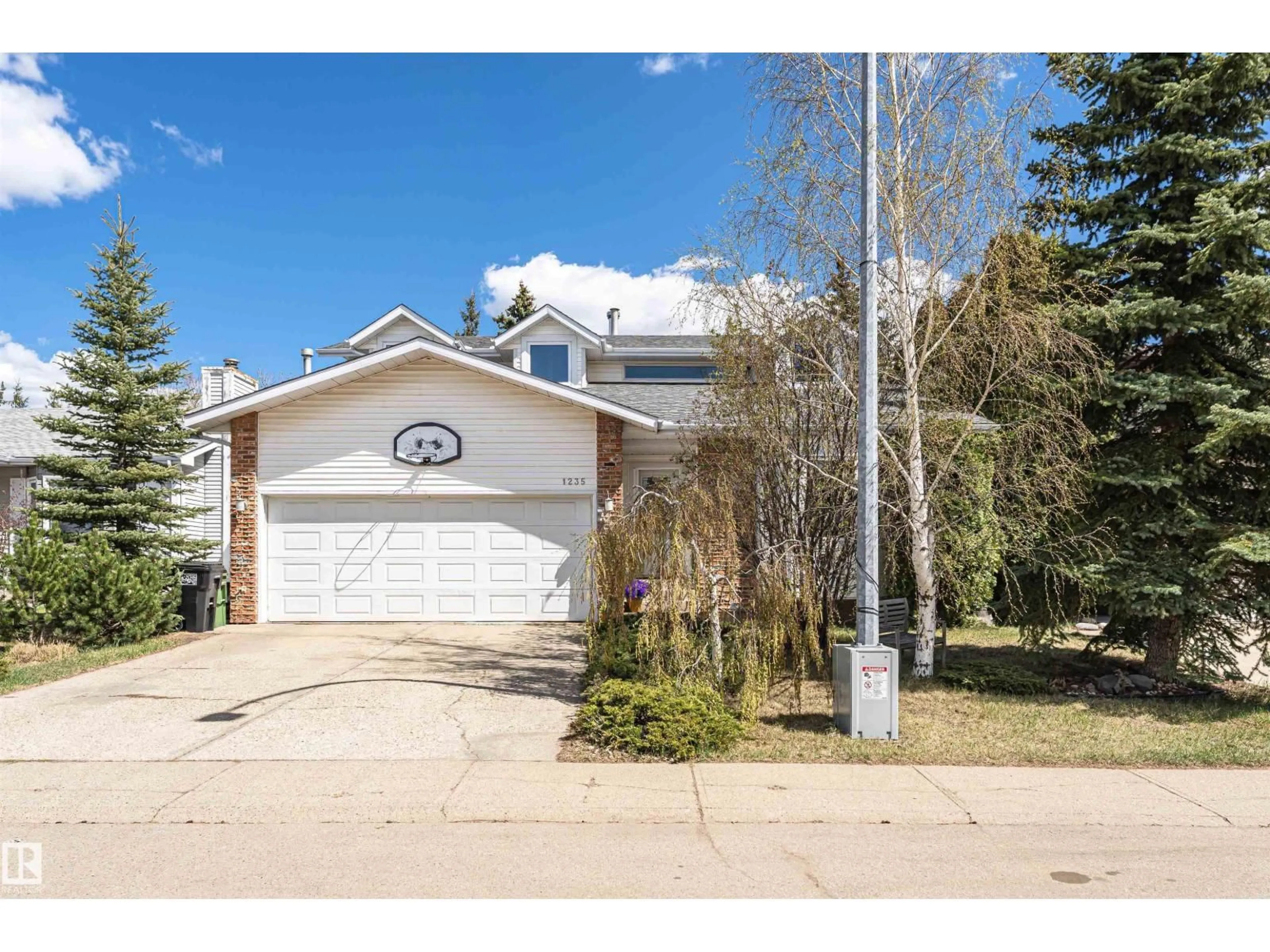 Home with vinyl exterior material, street for NW - 1235 104 ST, Edmonton Alberta T6J6E4