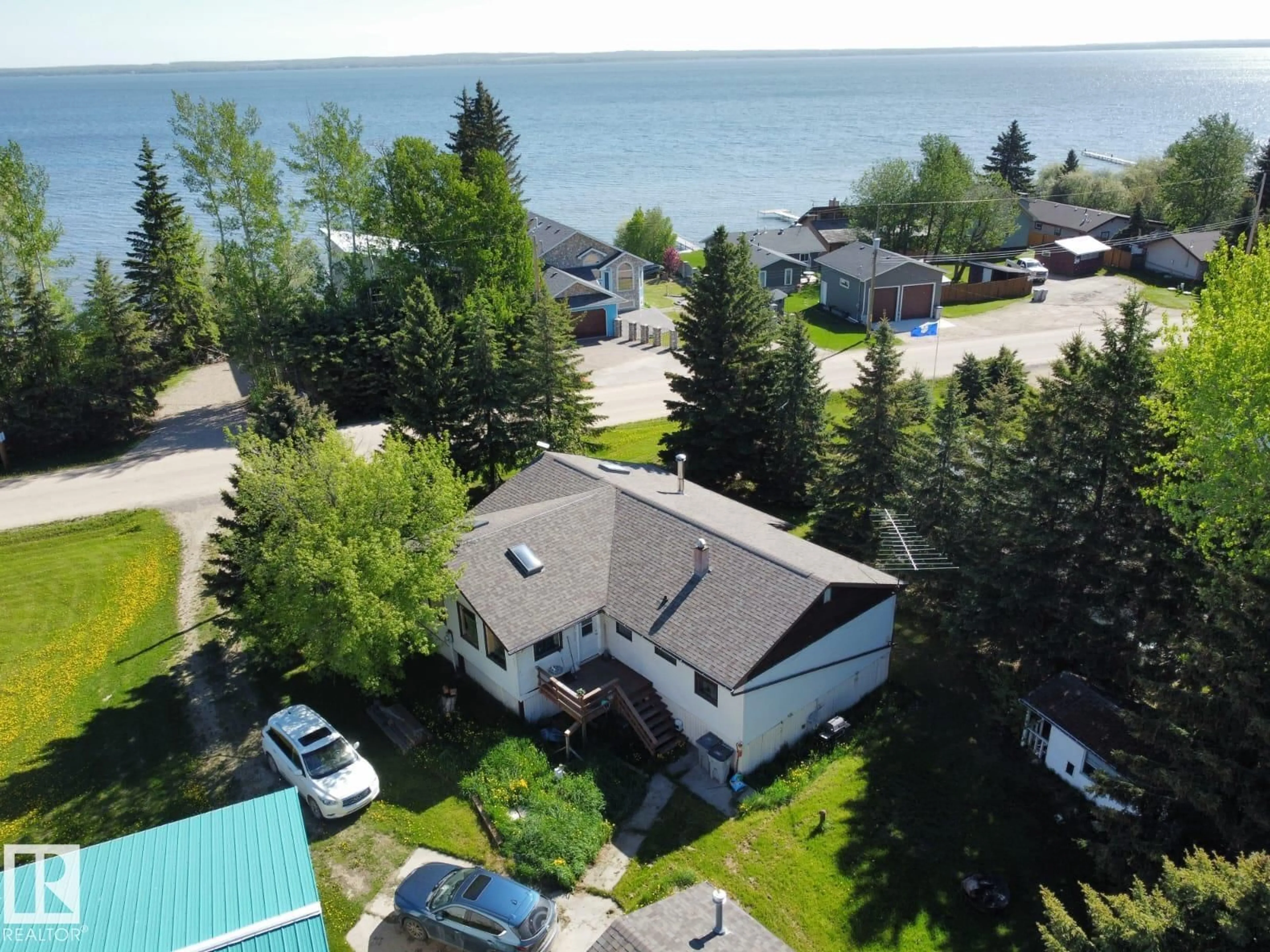 A pic from outside/outdoor area/front of a property/back of a property/a pic from drone, water/lake/river/ocean view for 26 LAKESHORE DR, Rural Wetaskiwin County Alberta T0C2V0