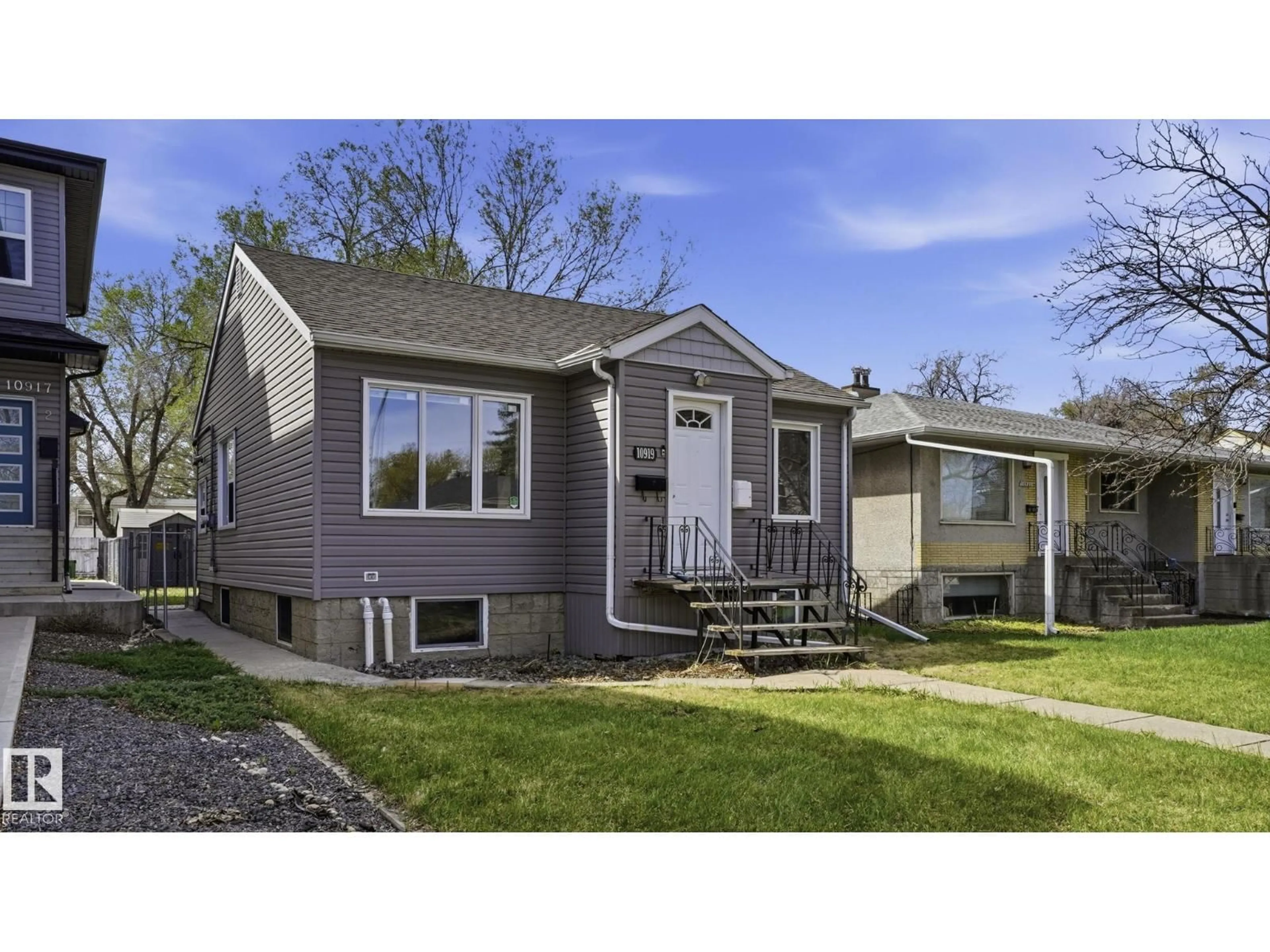 Home with vinyl exterior material, street for NW - 10919 68 AV, Edmonton Alberta T6H2B9