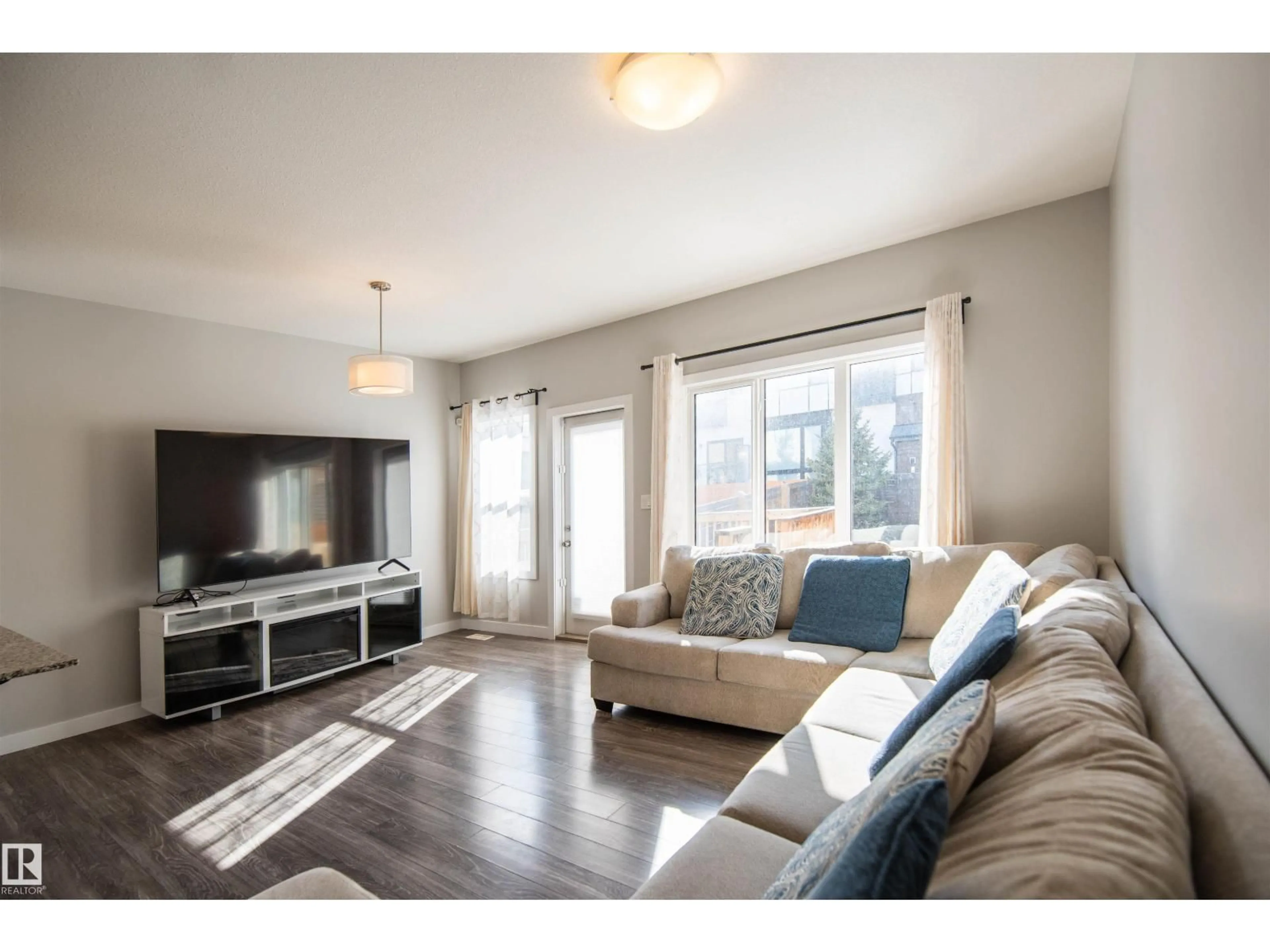 Living room with furniture, wood/laminate floor for SW - 1793 KEENE CR, Edmonton Alberta T6W3W3