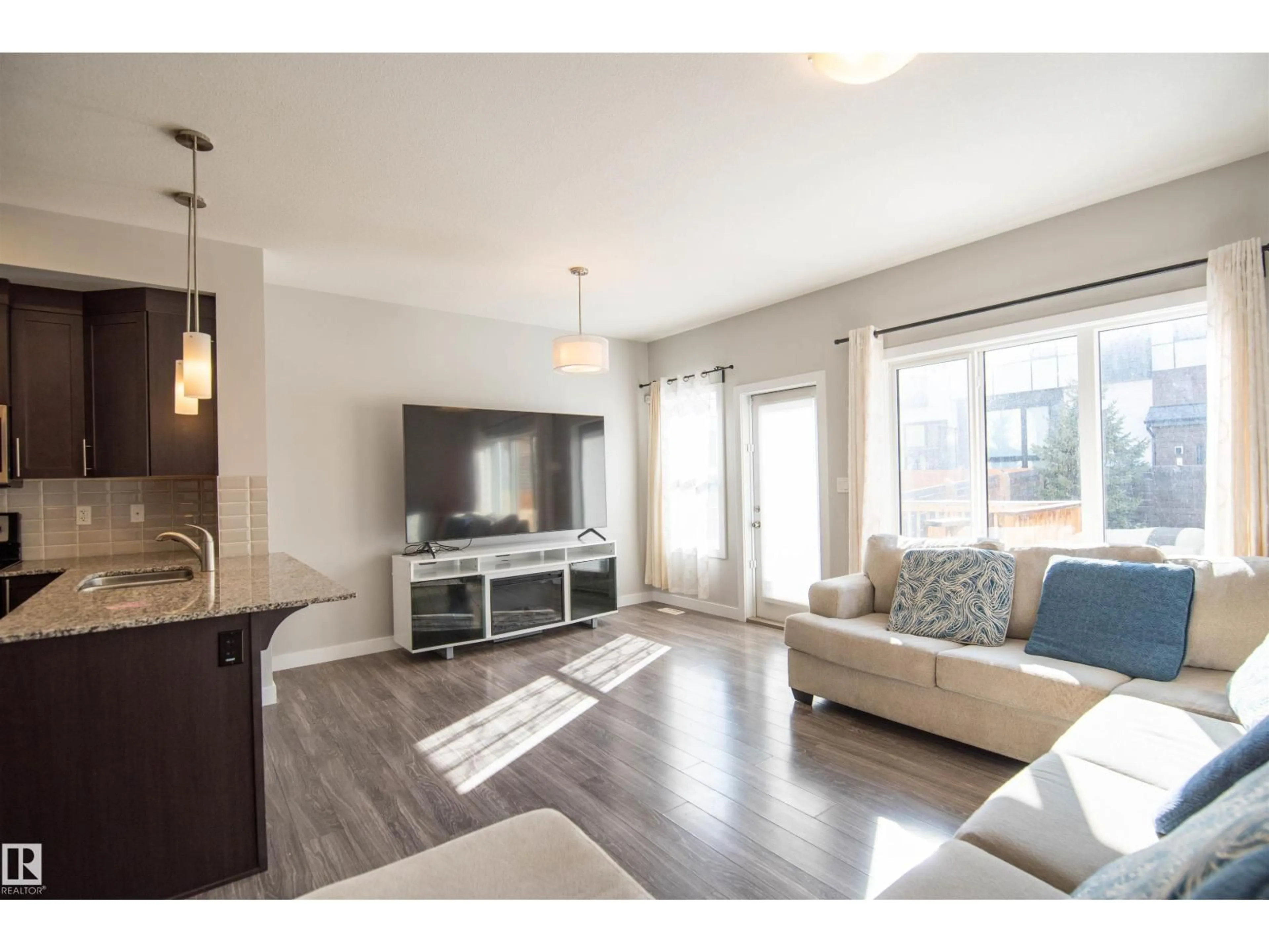 Living room with furniture, wood/laminate floor for SW - 1793 KEENE CR, Edmonton Alberta T6W3W3