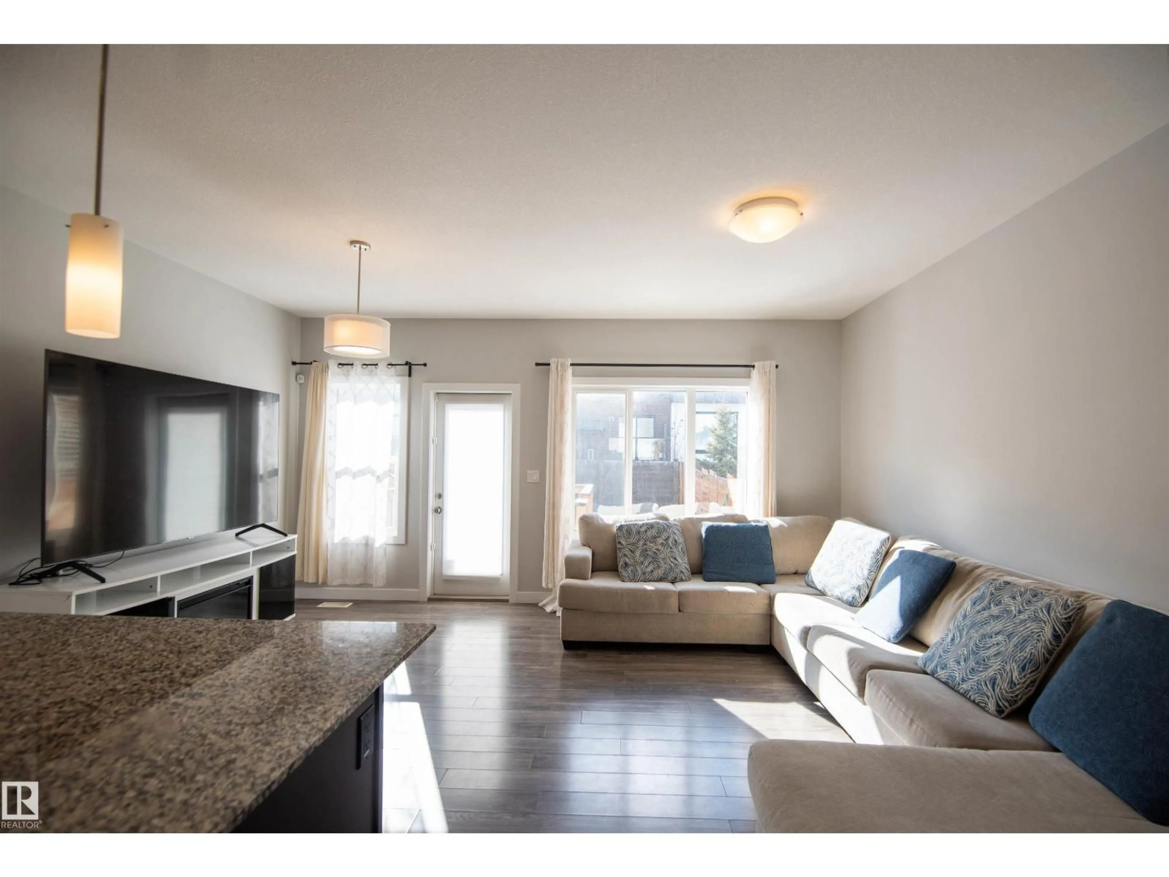 Living room with furniture, wood/laminate floor for SW - 1793 KEENE CR, Edmonton Alberta T6W3W3