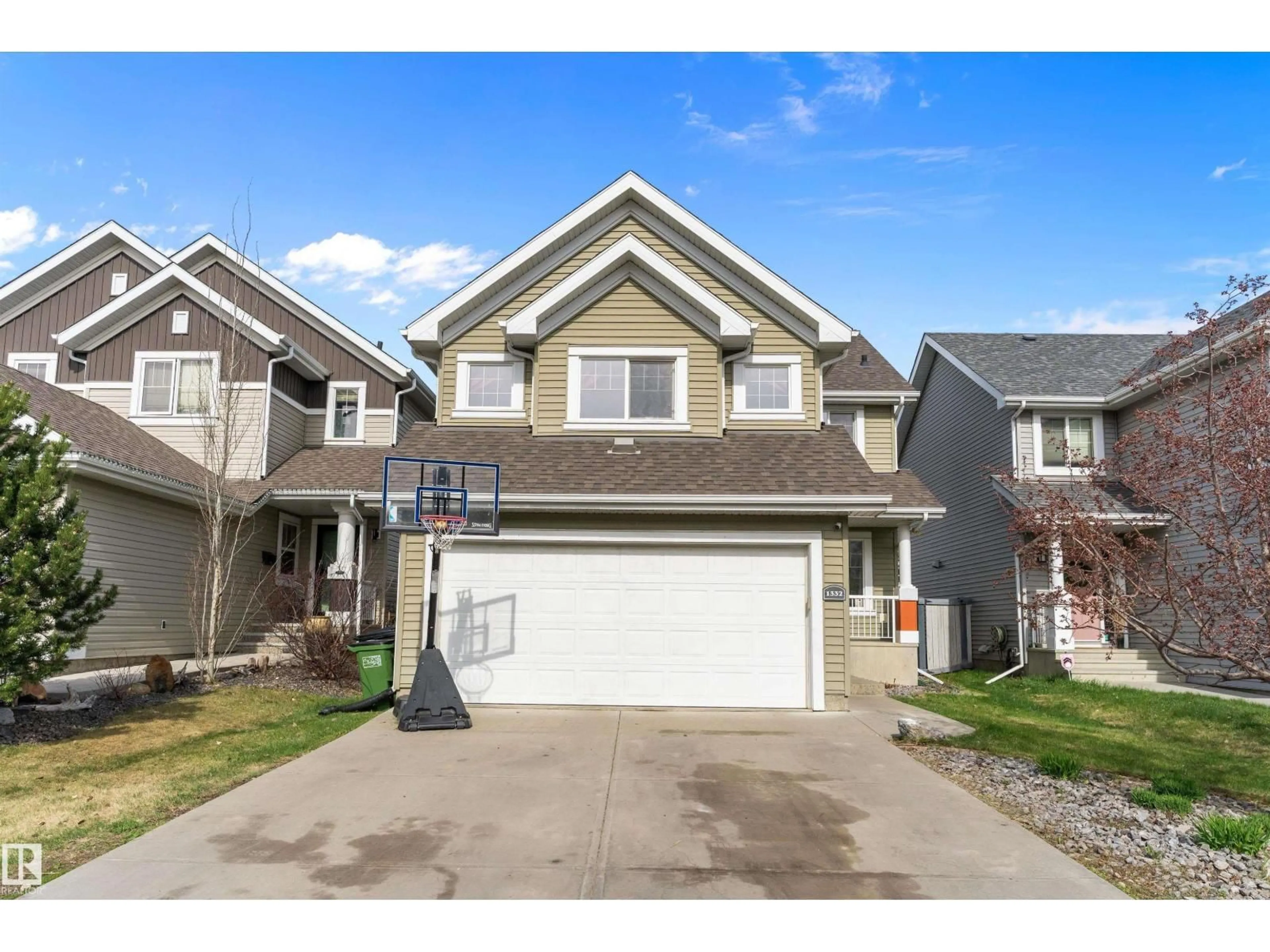 Home with vinyl exterior material, street for 1332 72 ST, Edmonton Alberta T6X0H2