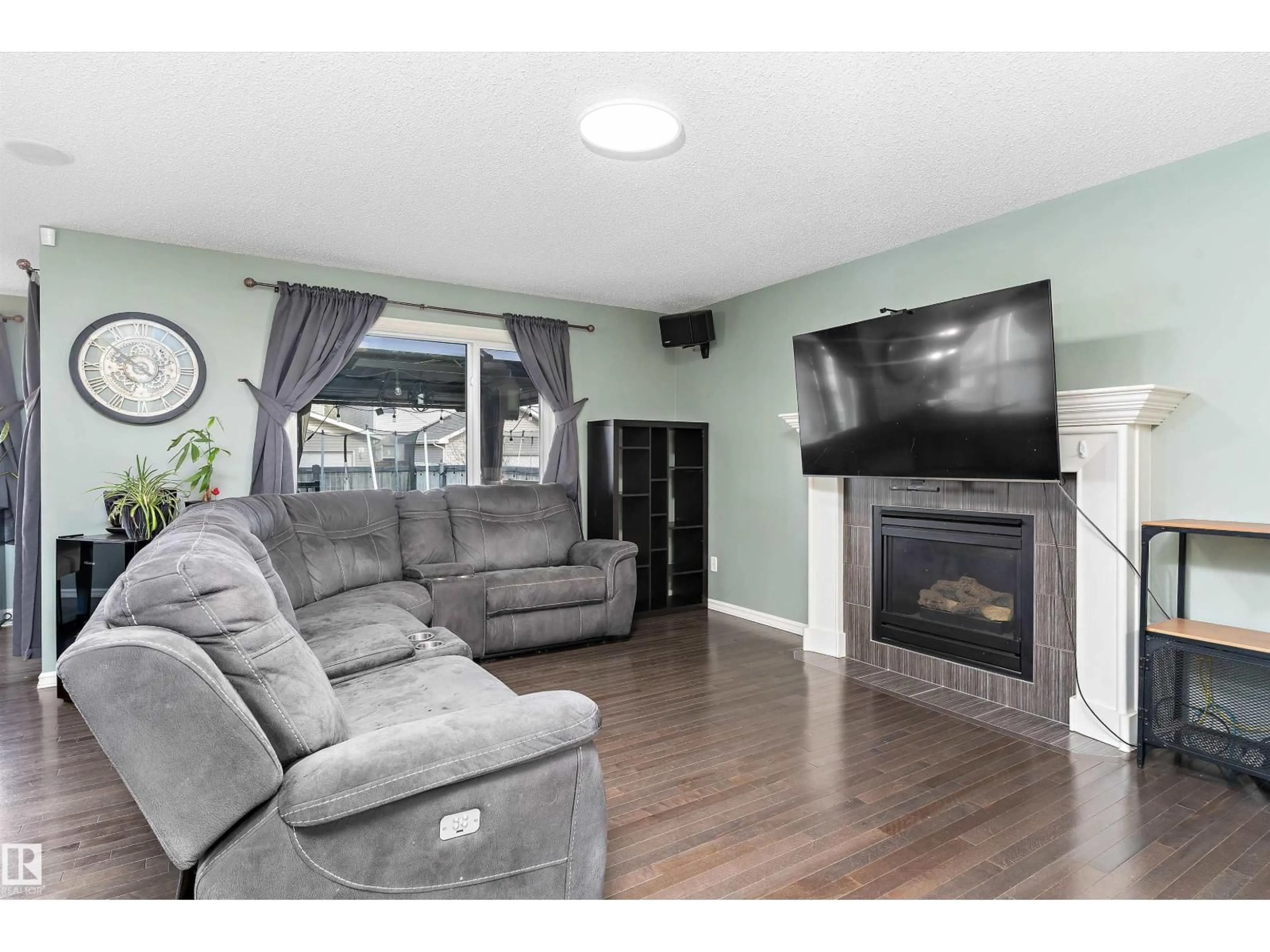 Living room with furniture, wood/laminate floor for 1332 72 ST, Edmonton Alberta T6X0H2