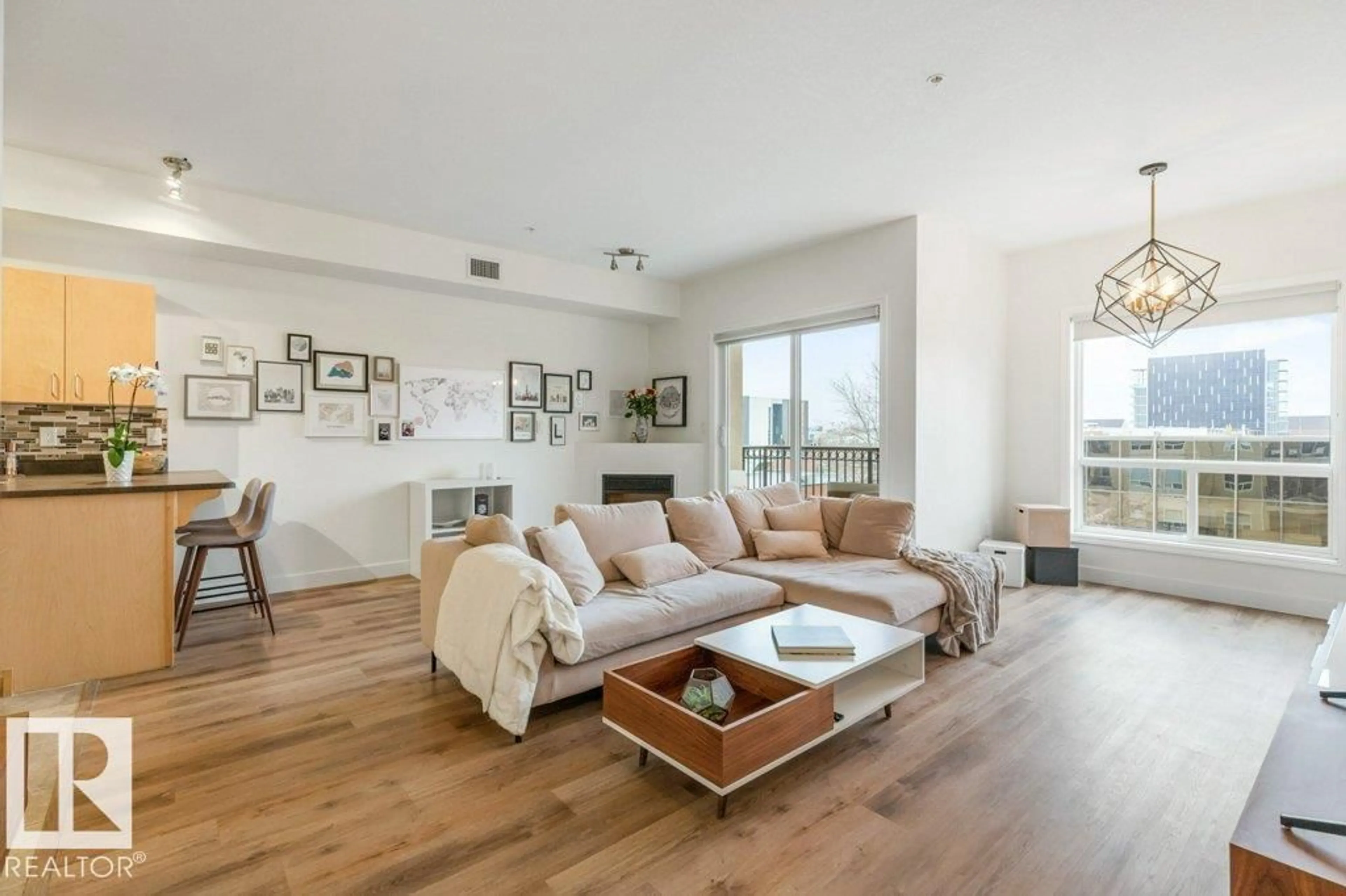 Living room with furniture, wood/laminate floor for #405 - 10606 102 AV, Edmonton Alberta T5J5E9