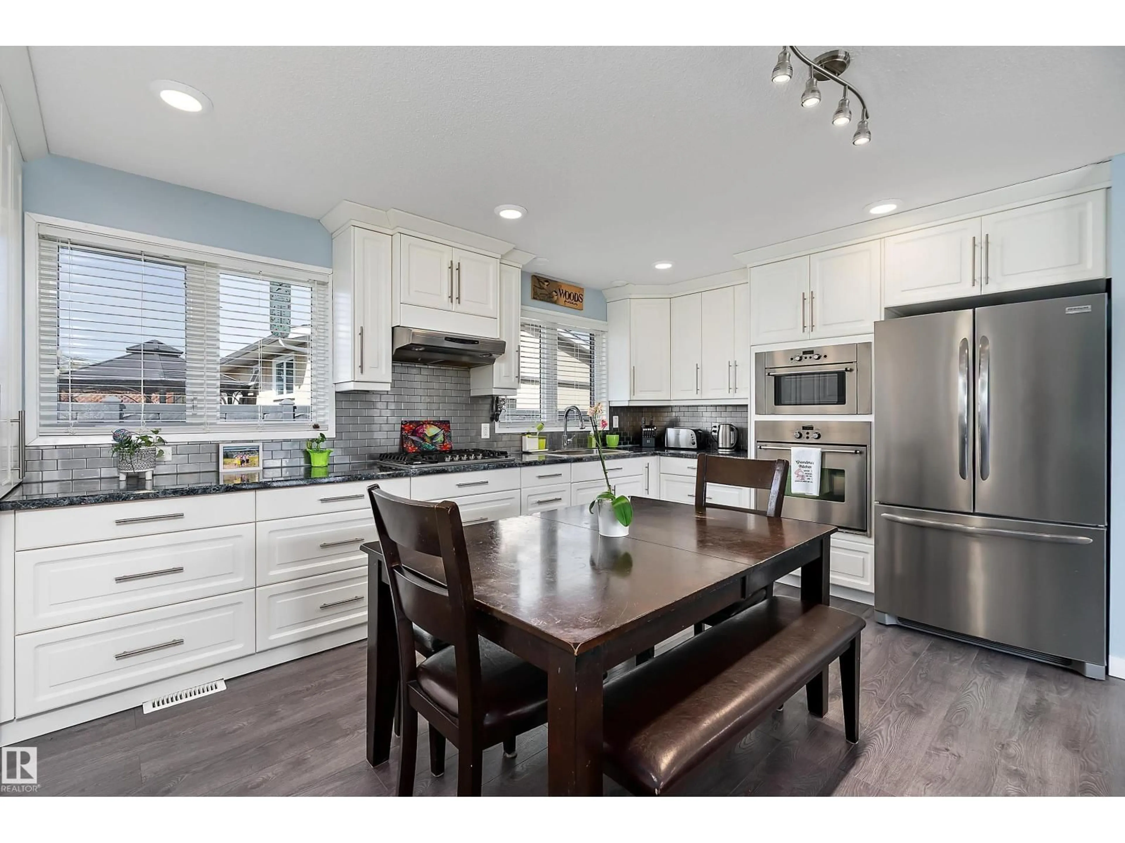 Open concept kitchen, wood/laminate floor for 17 CAMELOT AV, Leduc Alberta T9E4M4