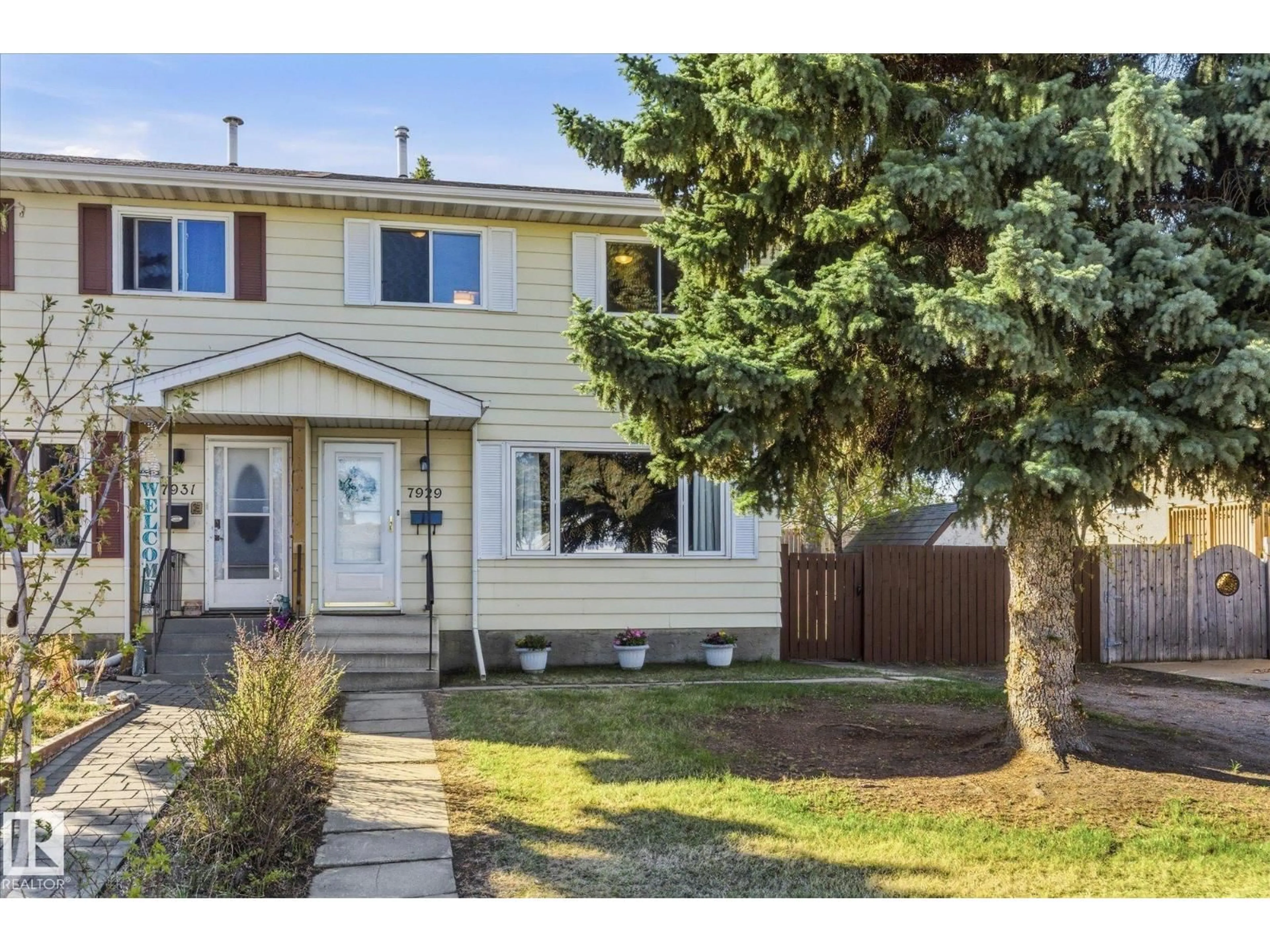 Home with vinyl exterior material, street for 7929 95B AV, Fort Saskatchewan Alberta T8L3C9