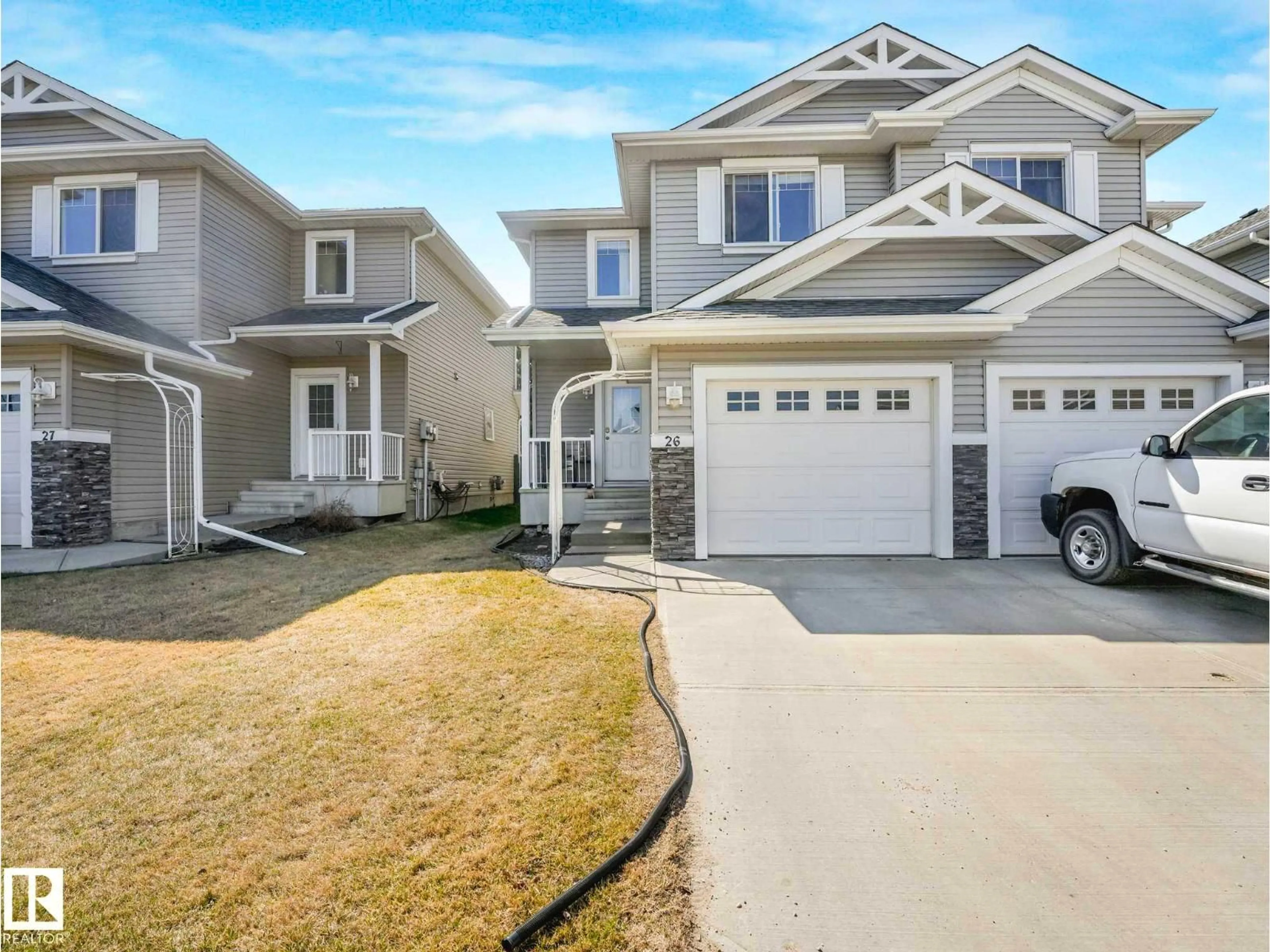 Home with vinyl exterior material, street for 26 5101 SOLEIL BV, Beaumont Alberta T4X0E3