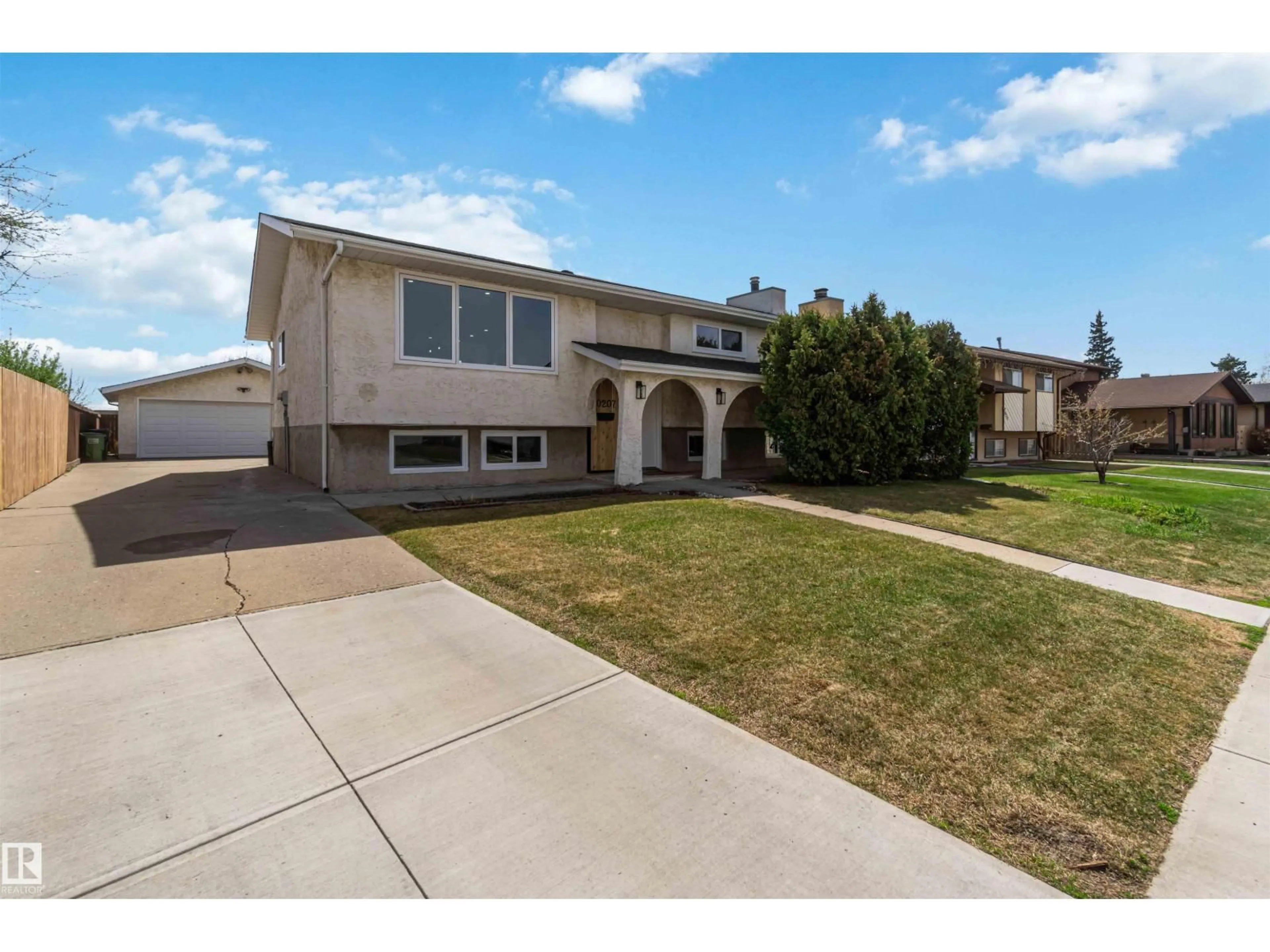 Home with vinyl exterior material, street for 10207 165 AV, Edmonton Alberta T5X2B8