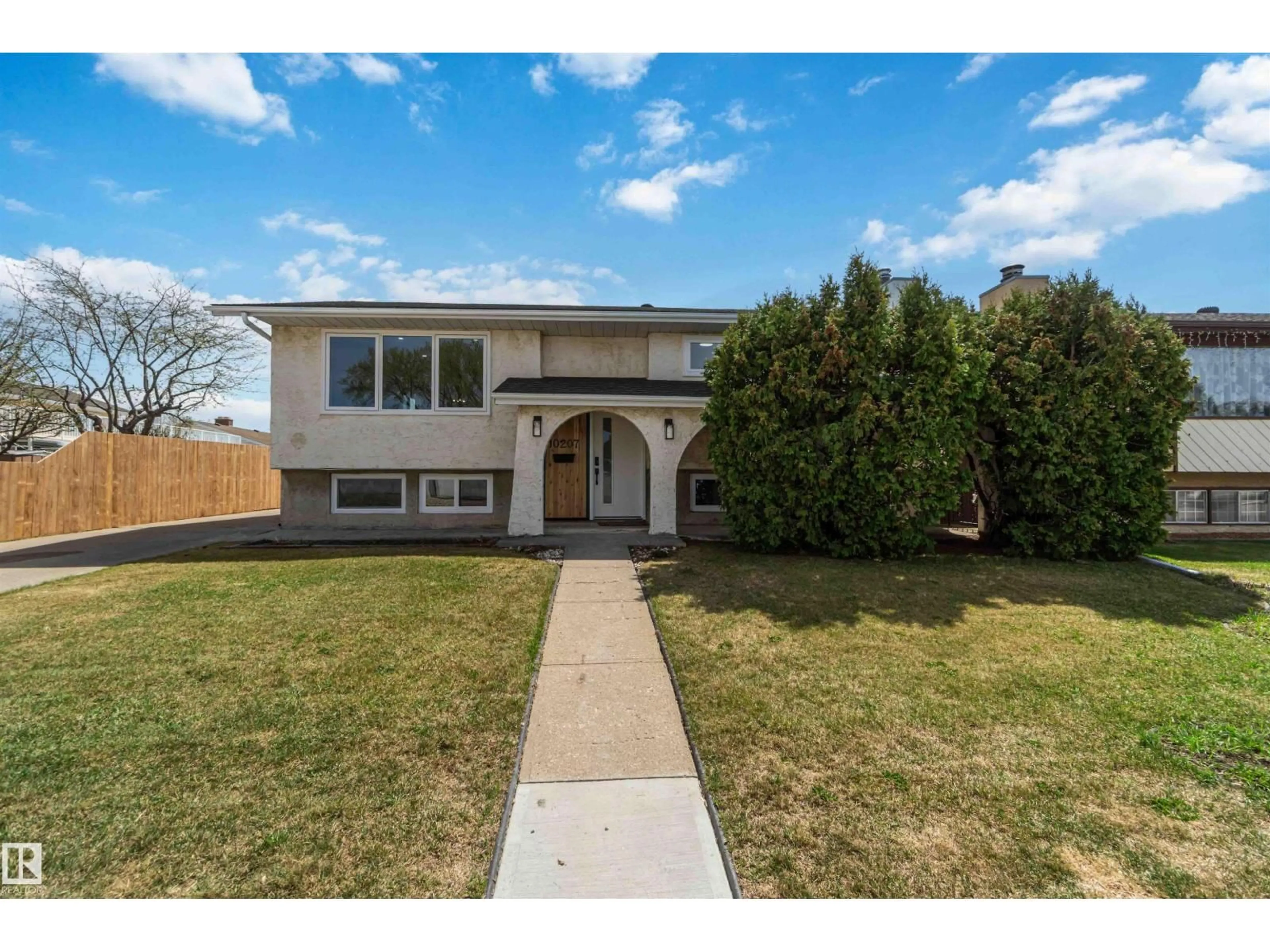 Home with vinyl exterior material, street for 10207 165 AV, Edmonton Alberta T5X2B8