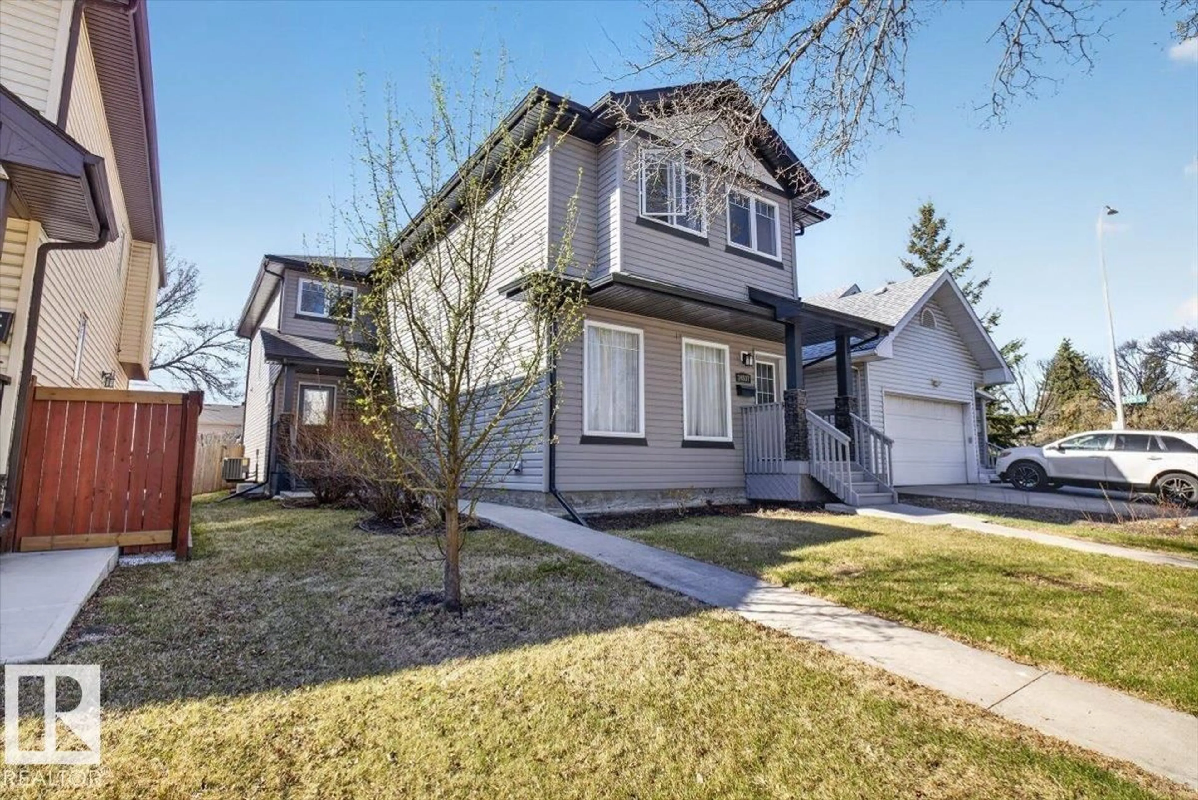 Home with vinyl exterior material, street for 14835 103 AV, Edmonton Alberta T5N0V2