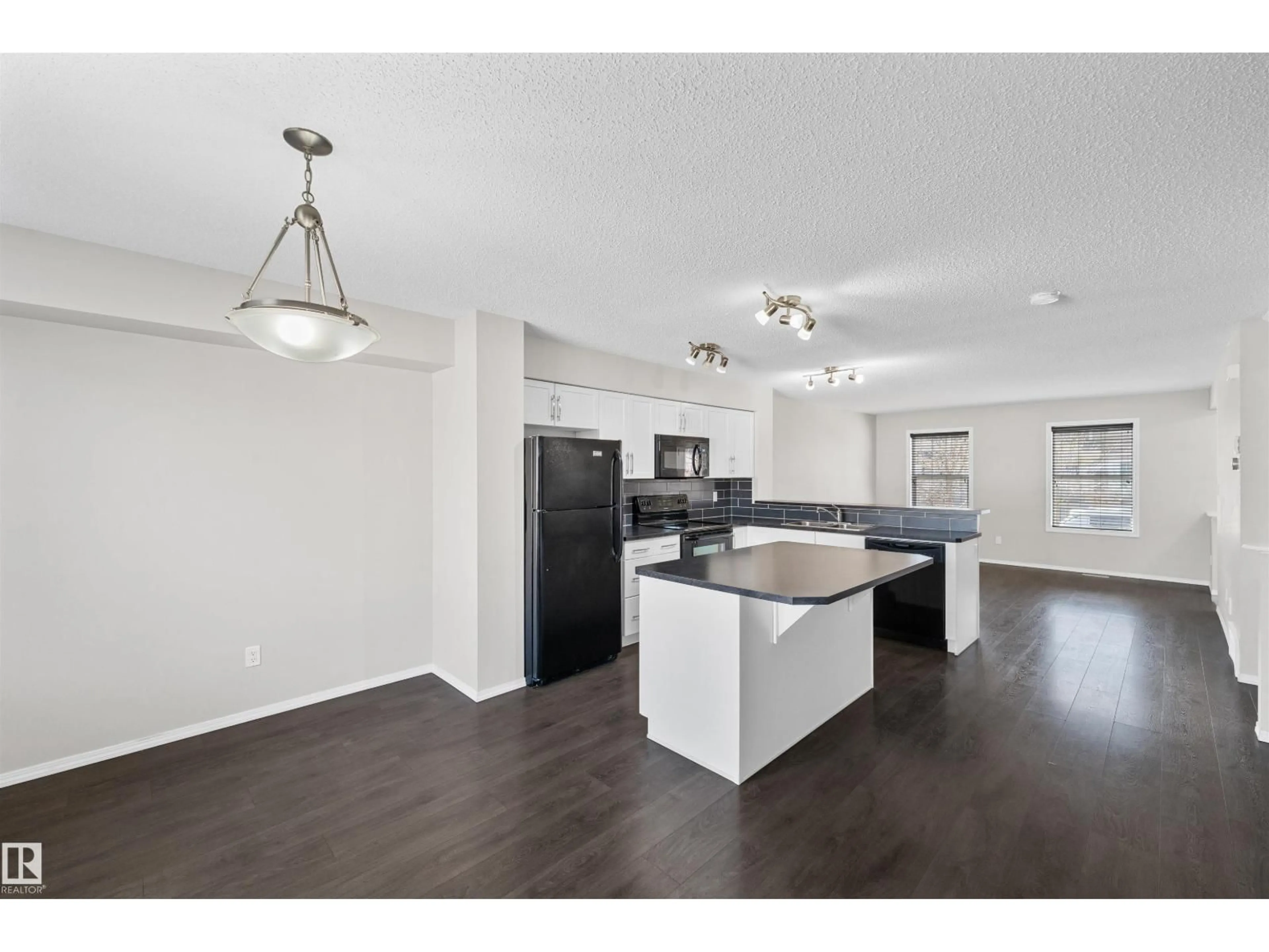 Open concept kitchen, wood/laminate floor for SW - 3041 ARTHURS CR, Edmonton Alberta T6W2H8