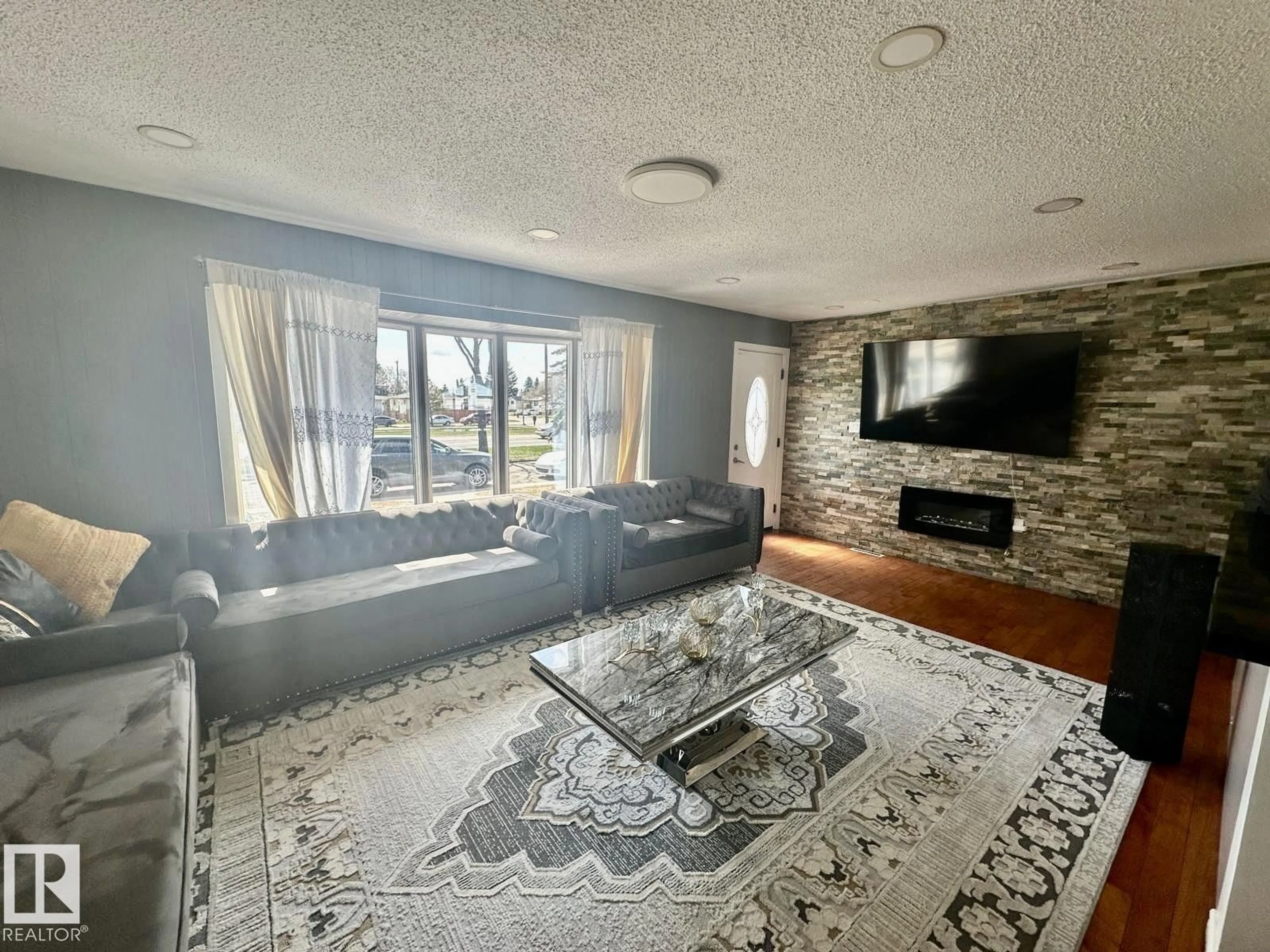 Living room with furniture, unknown for 8620 137 AV, Edmonton Alberta T5E1X0