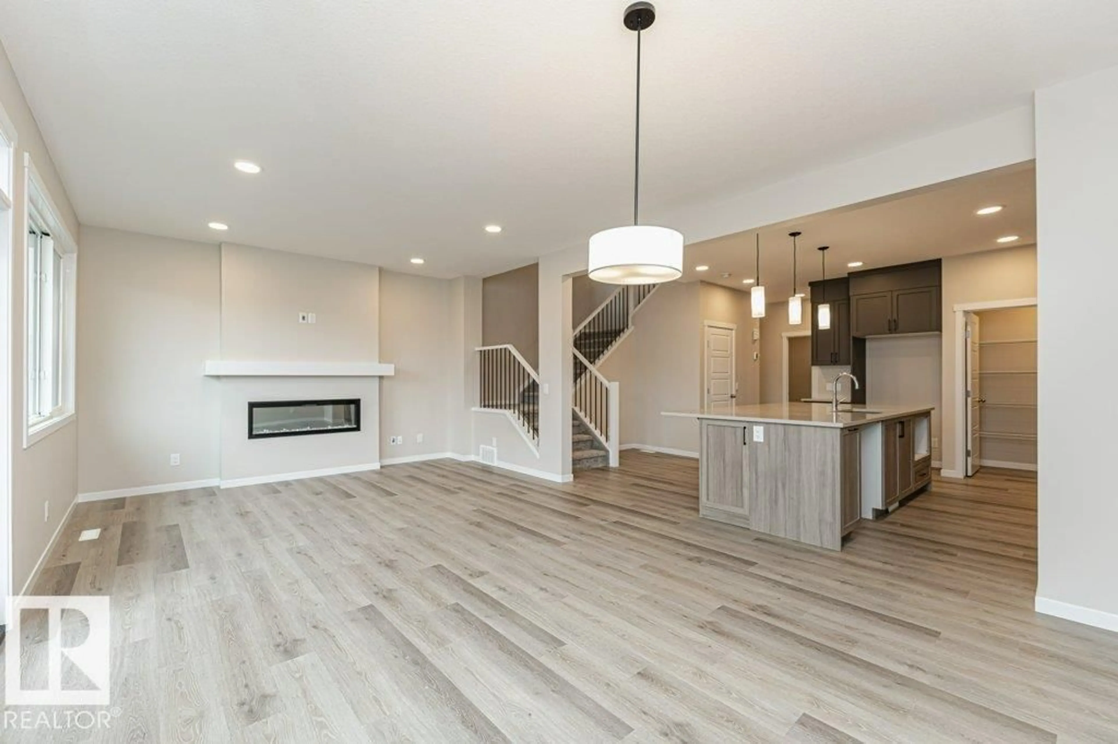 Open concept kitchen, wood/laminate floor for 2616 158 ST, Edmonton Alberta T6W5P6