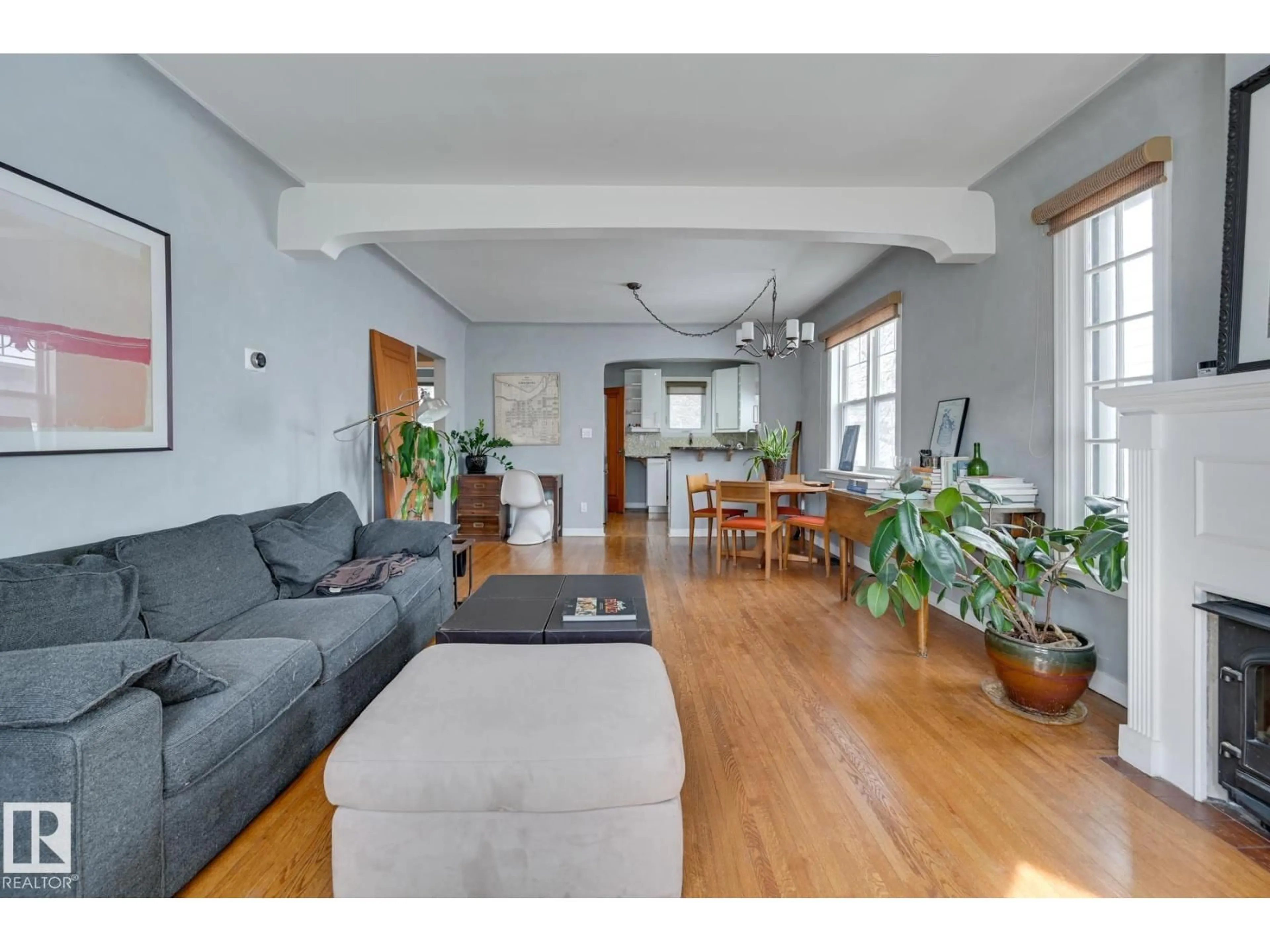 Living room with furniture, wood/laminate floor for 10038 88 AV, Edmonton Alberta T6E2R7