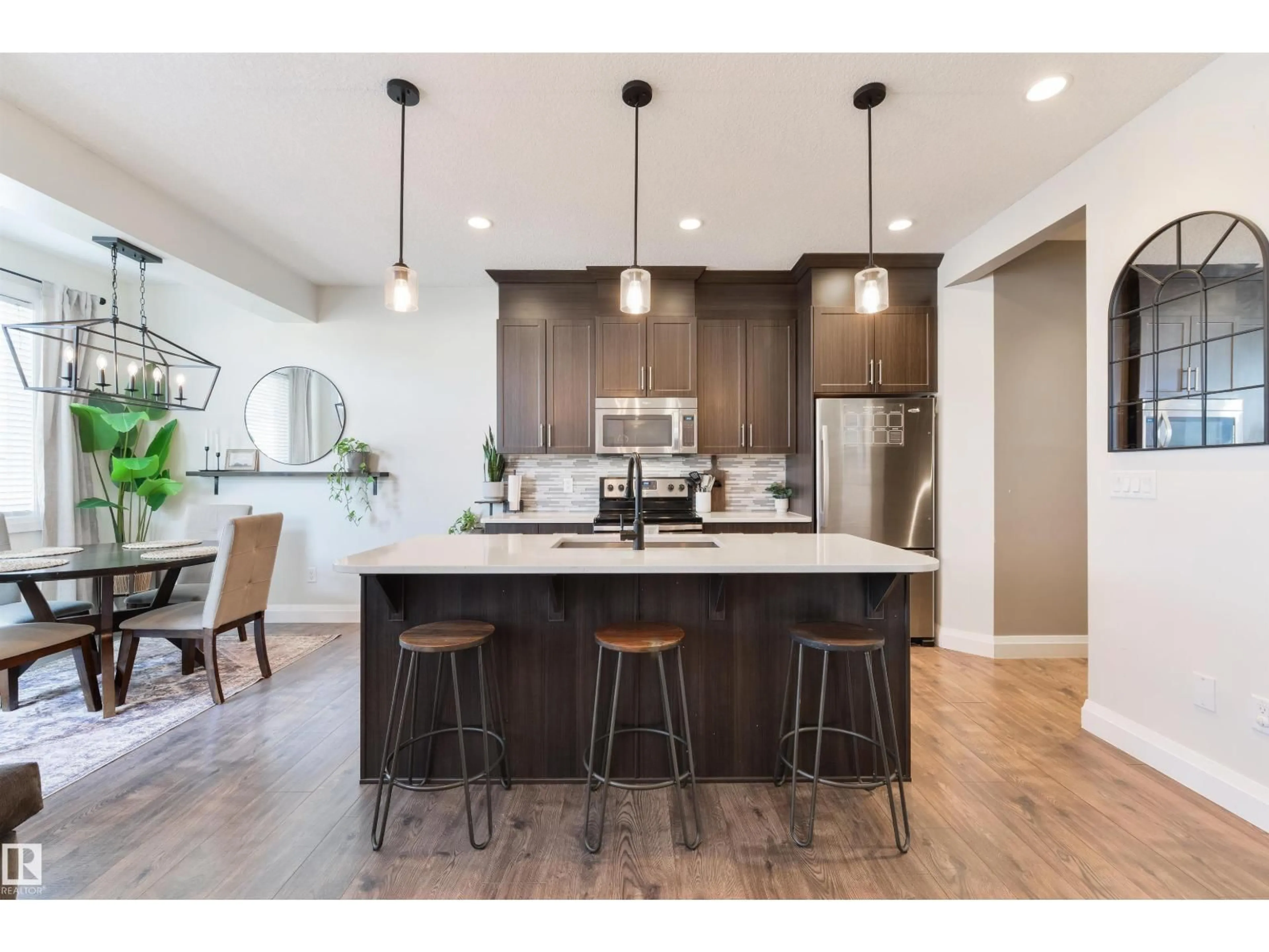 Open concept kitchen, wood/laminate floor for 20 SPRINGWOOD WY, Spruce Grove Alberta T7X0L4