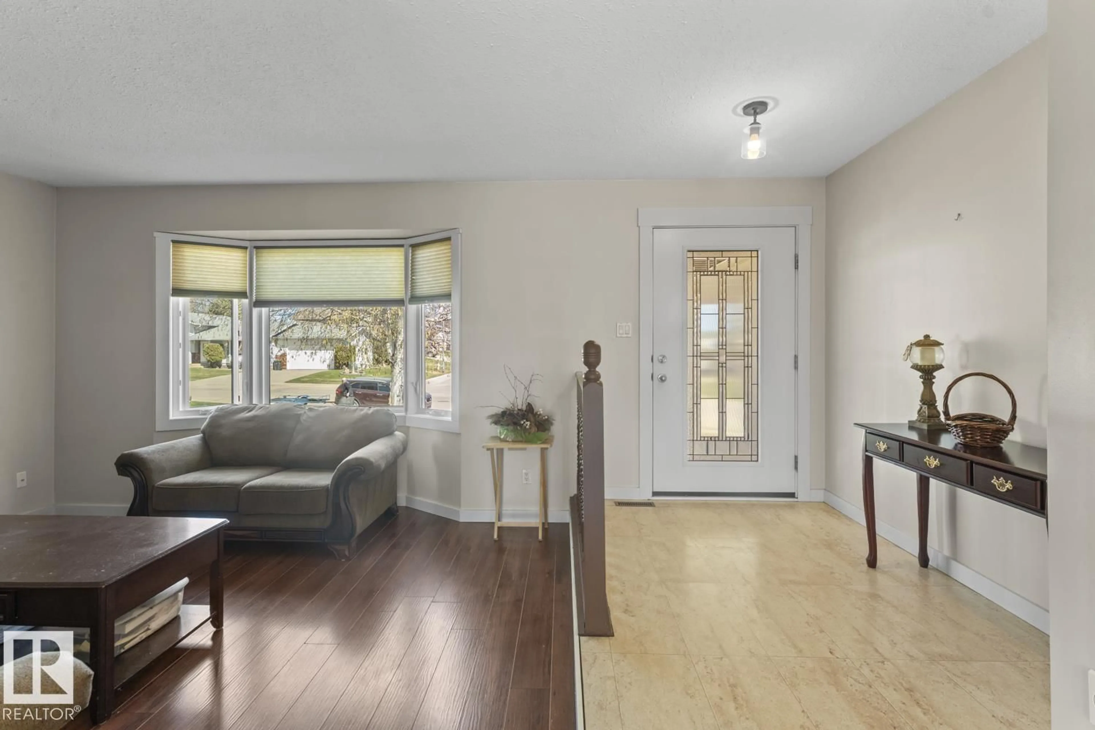 Living room with furniture, wood/laminate floor for 1938 FOREST DR, Cold Lake Alberta T9M1M1