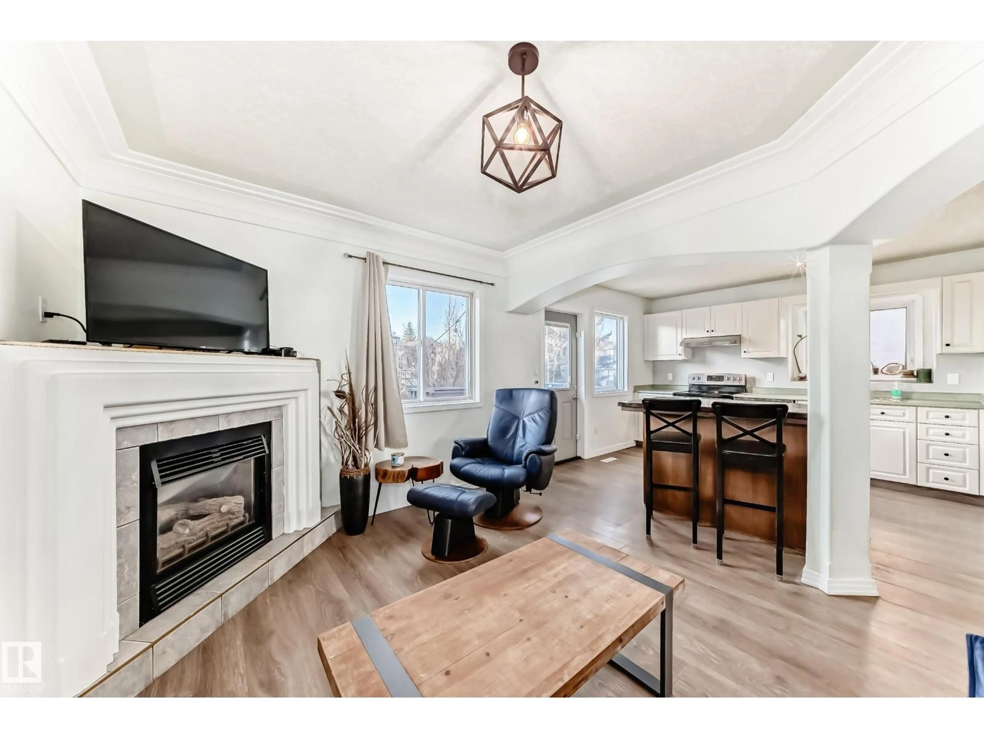 Living room with furniture, wood/laminate floor for 1619 WELBOURN COVE CV, Edmonton Alberta T6M2M5