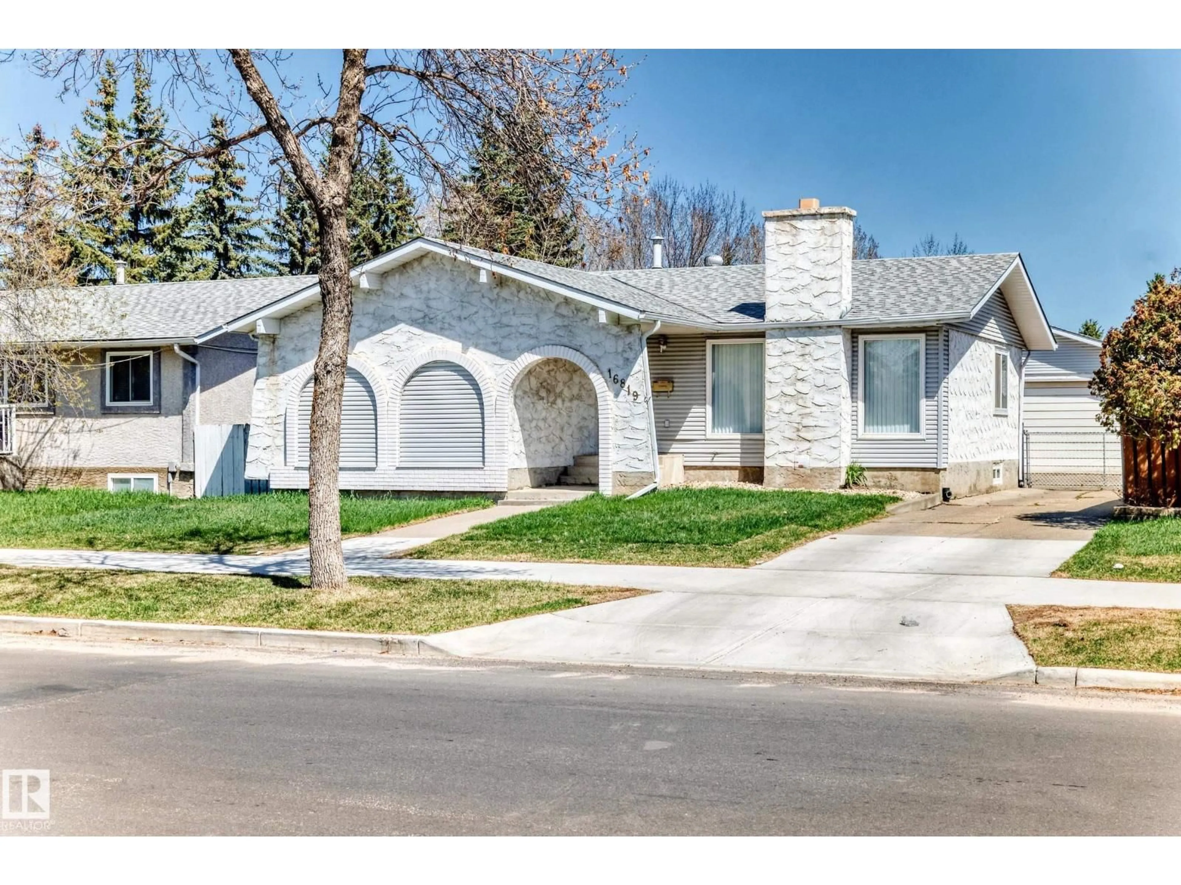 Home with vinyl exterior material, street for NW - 16819 109 ST, Edmonton Alberta T5X2R5