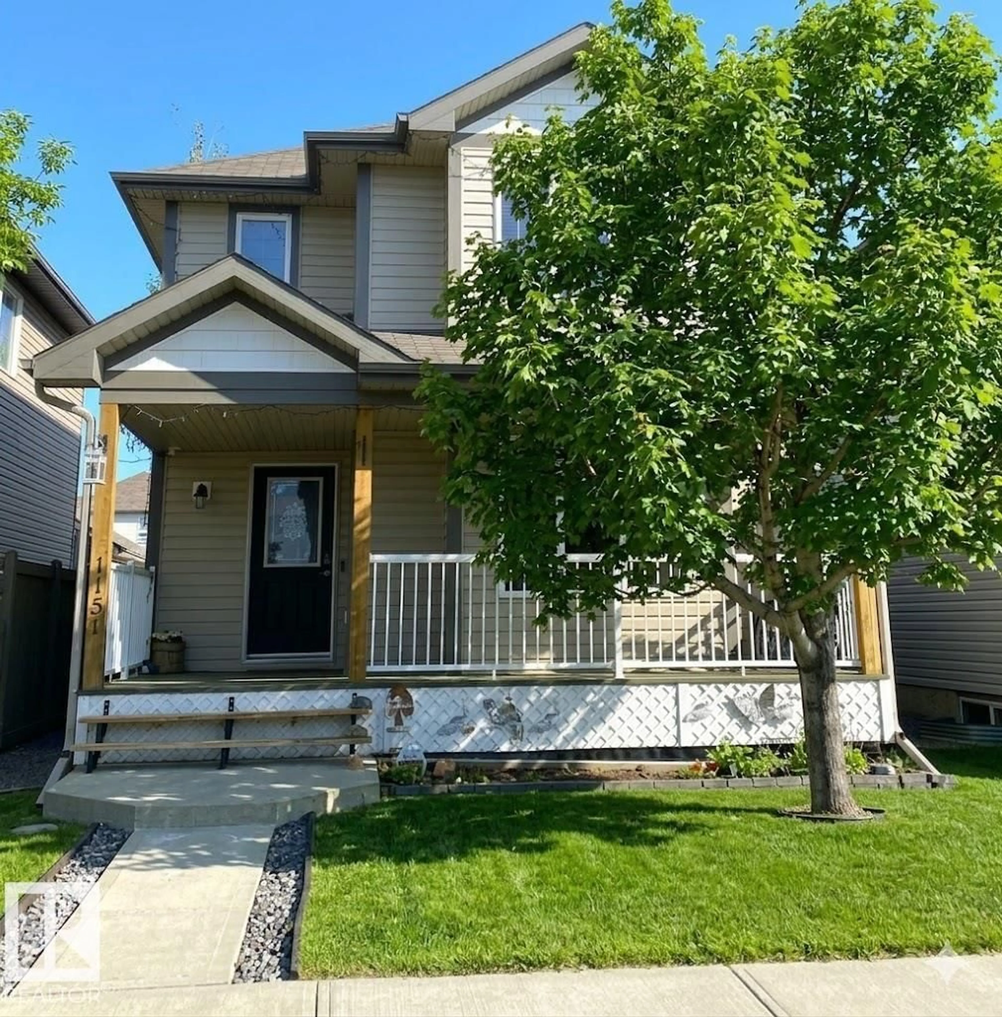 Home with vinyl exterior material, street for 1151 37 AV, Edmonton Alberta T6T0E8