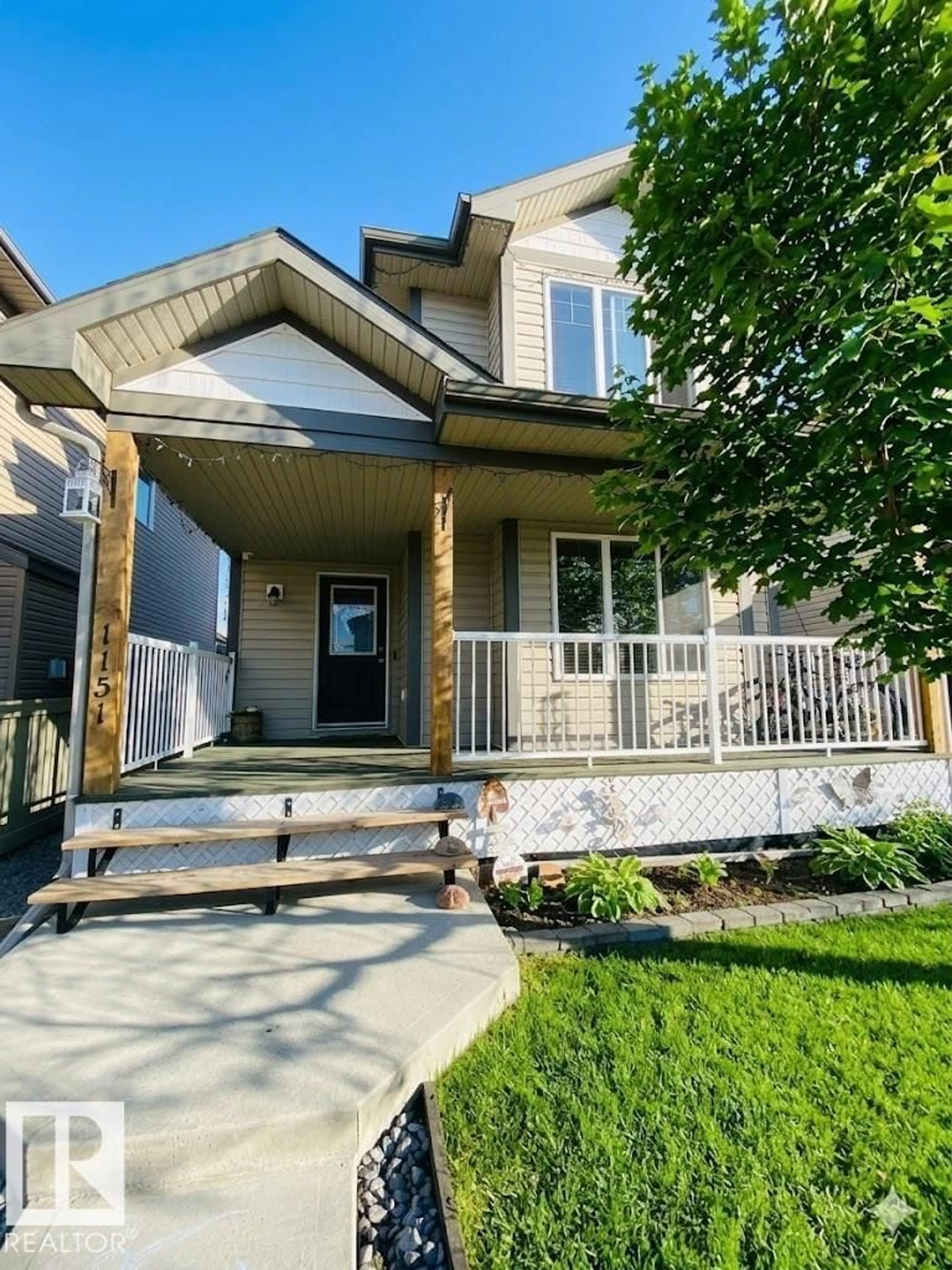 Home with vinyl exterior material, street for 1151 37 AV, Edmonton Alberta T6T0E8
