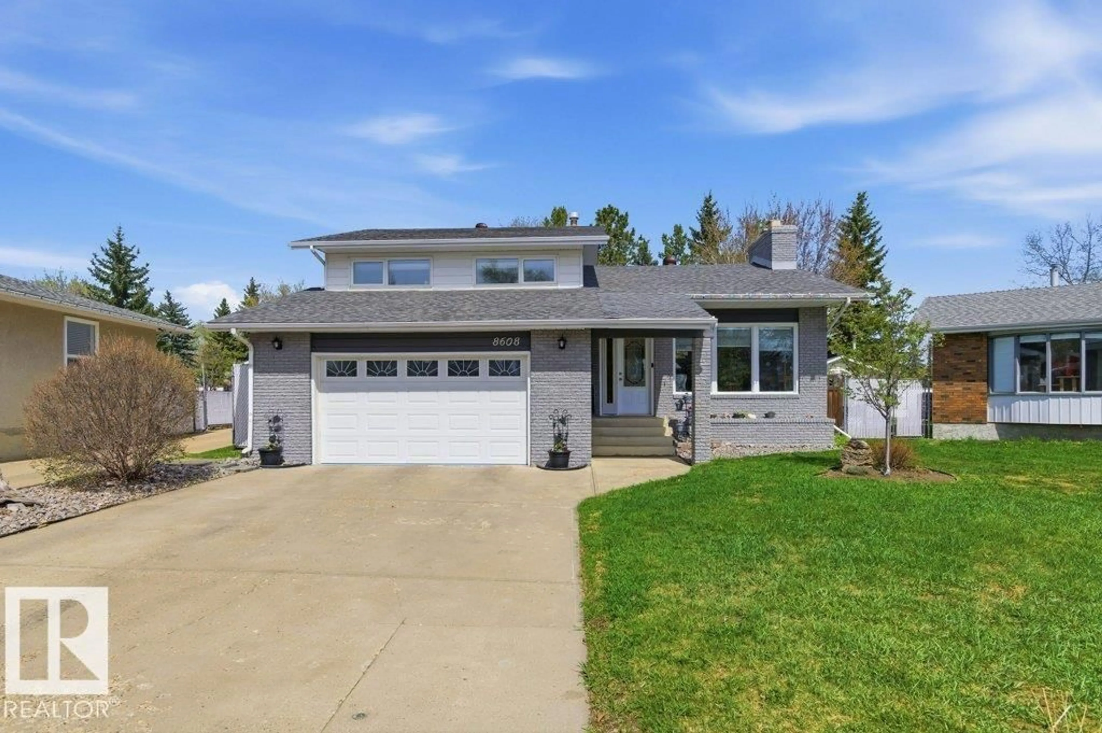 Home with vinyl exterior material, street for 8608 22 AVE, Edmonton Alberta T6K1Z8