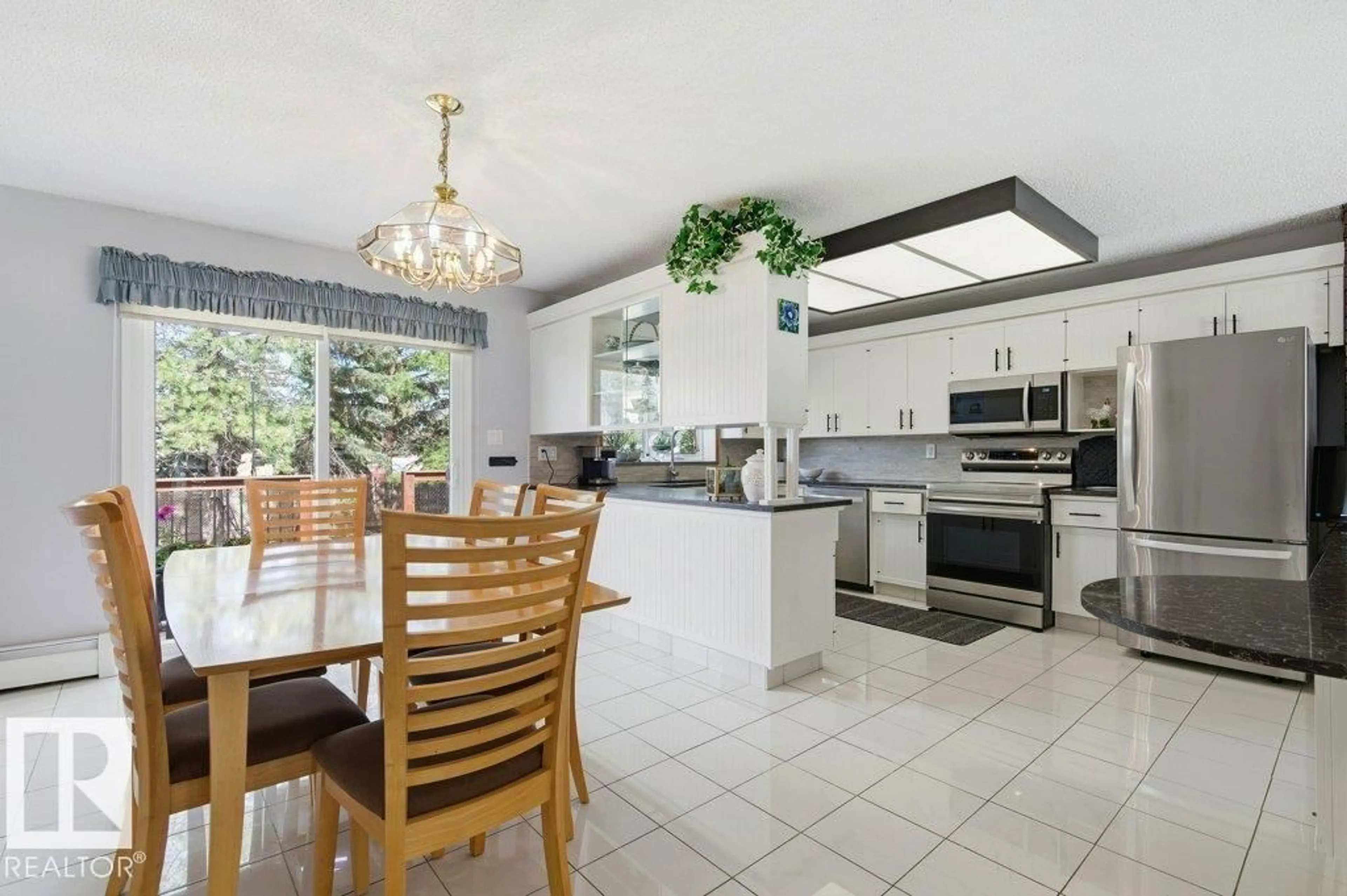 Open concept kitchen, ceramic/tile floor for 8608 22 AVE, Edmonton Alberta T6K1Z8