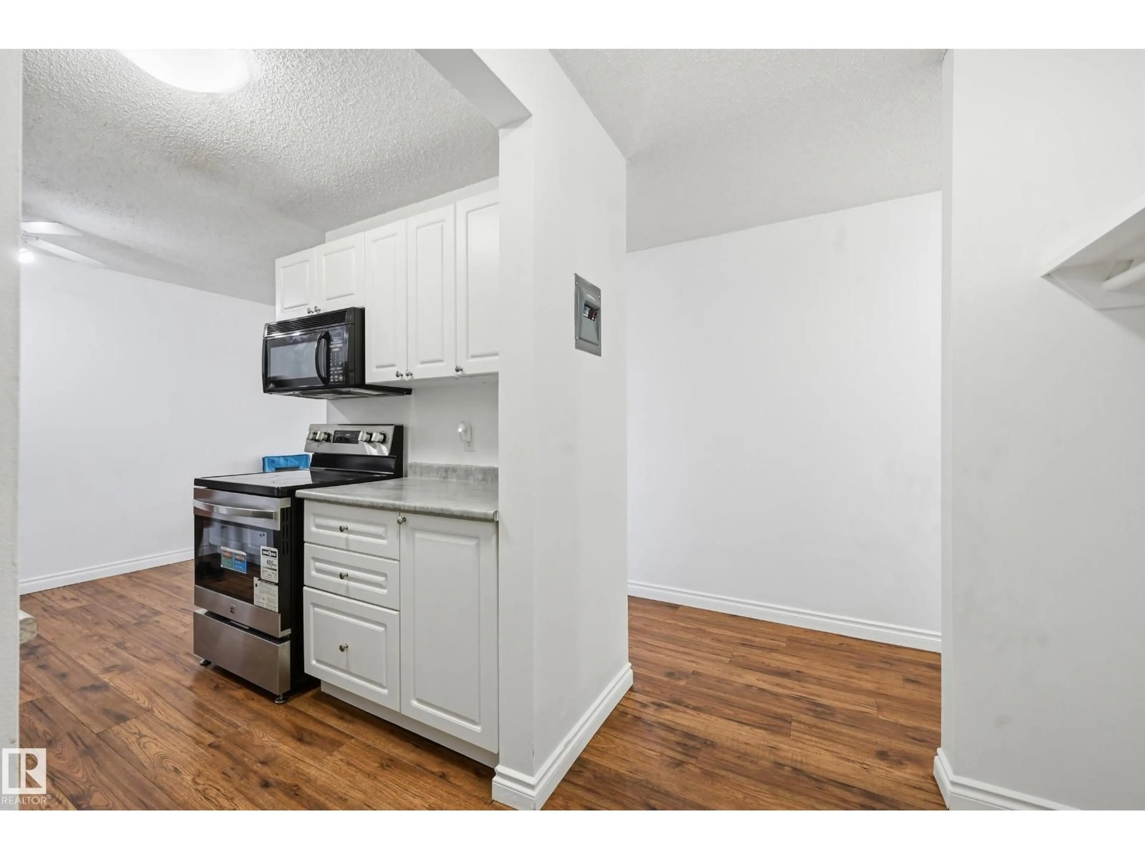 Standard kitchen, wood/laminate floor for 305 - 10811 115 ST NW, Edmonton Alberta T5H3L2