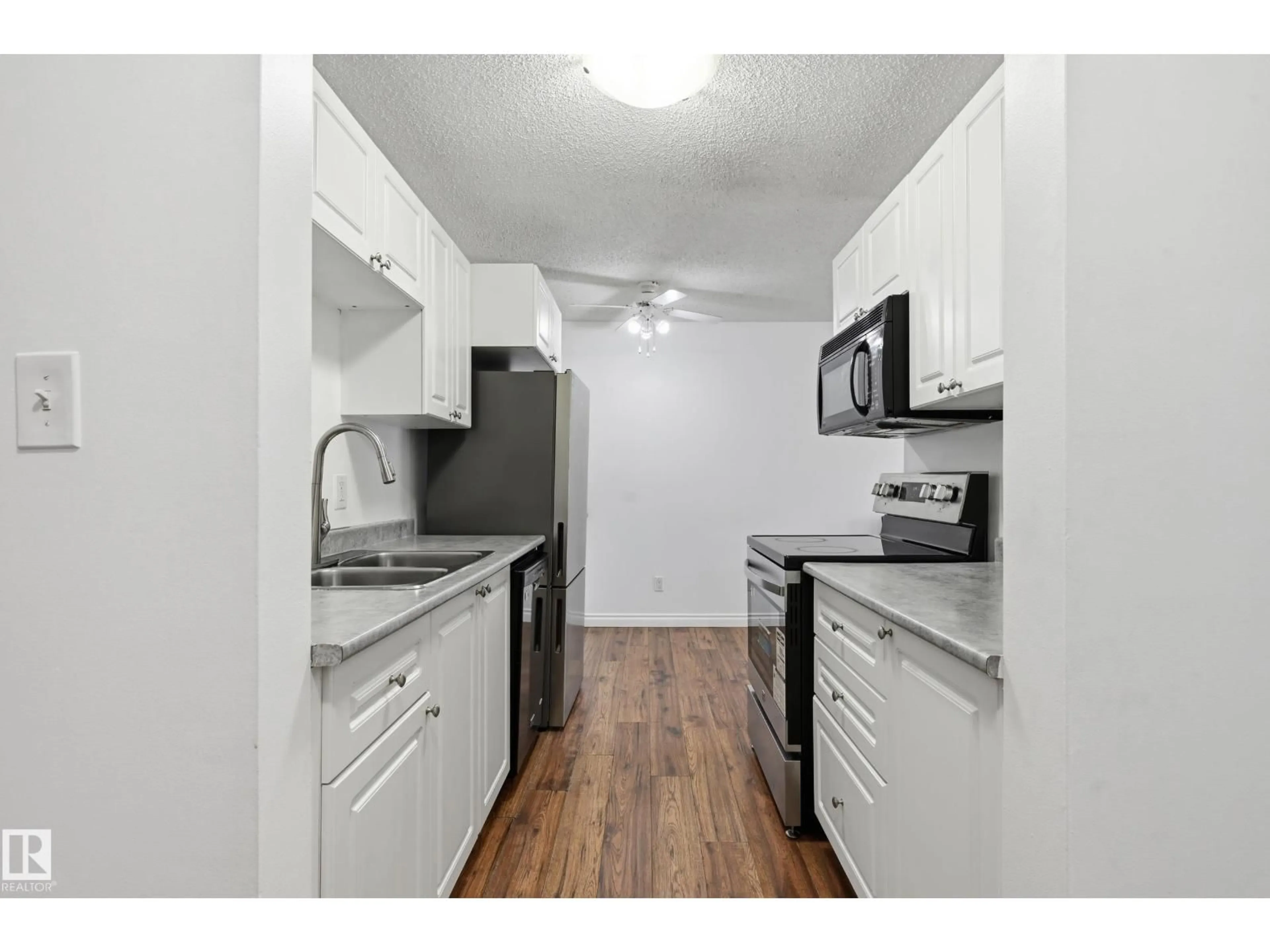 Standard kitchen, wood/laminate floor for 305 - 10811 115 ST NW, Edmonton Alberta T5H3L2