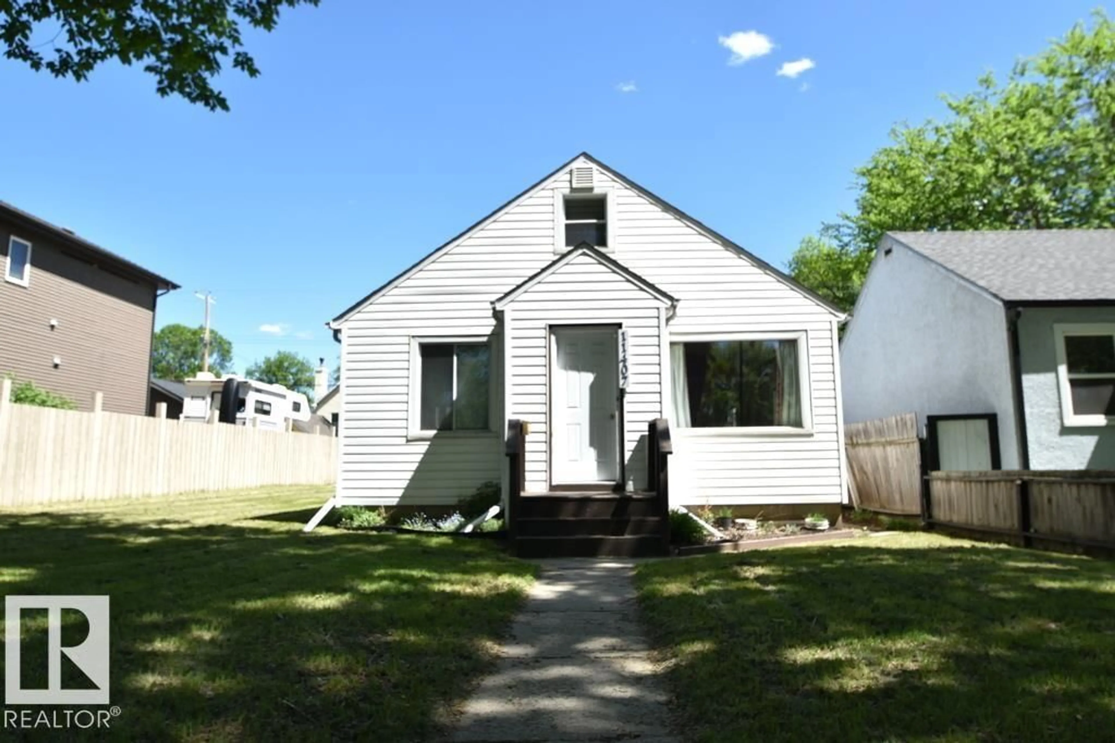 Home with vinyl exterior material, street for 11407 68 ST, Edmonton Alberta T5B1N9